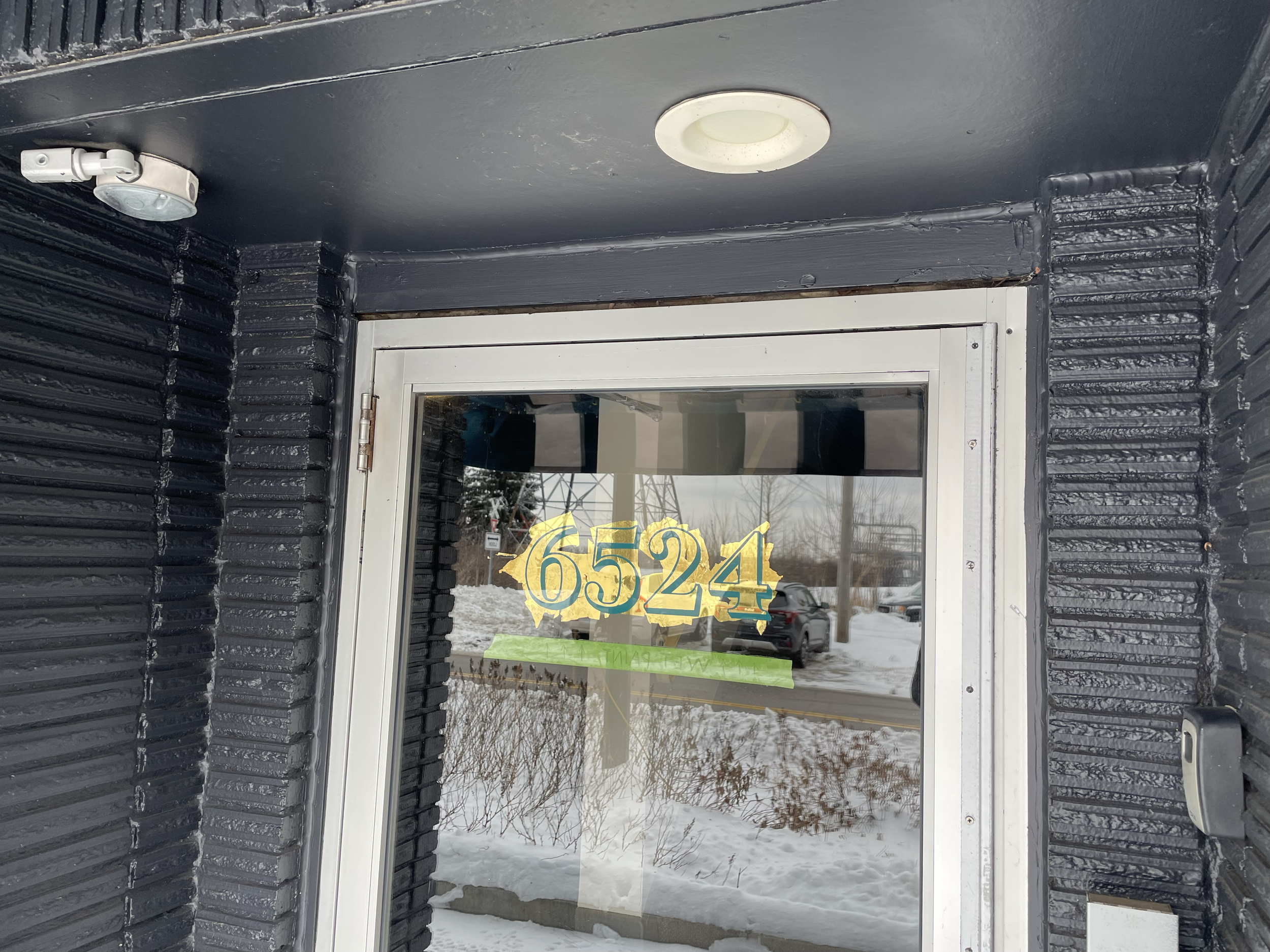Reverse glass gold leaf address numbers for Sota Clothing