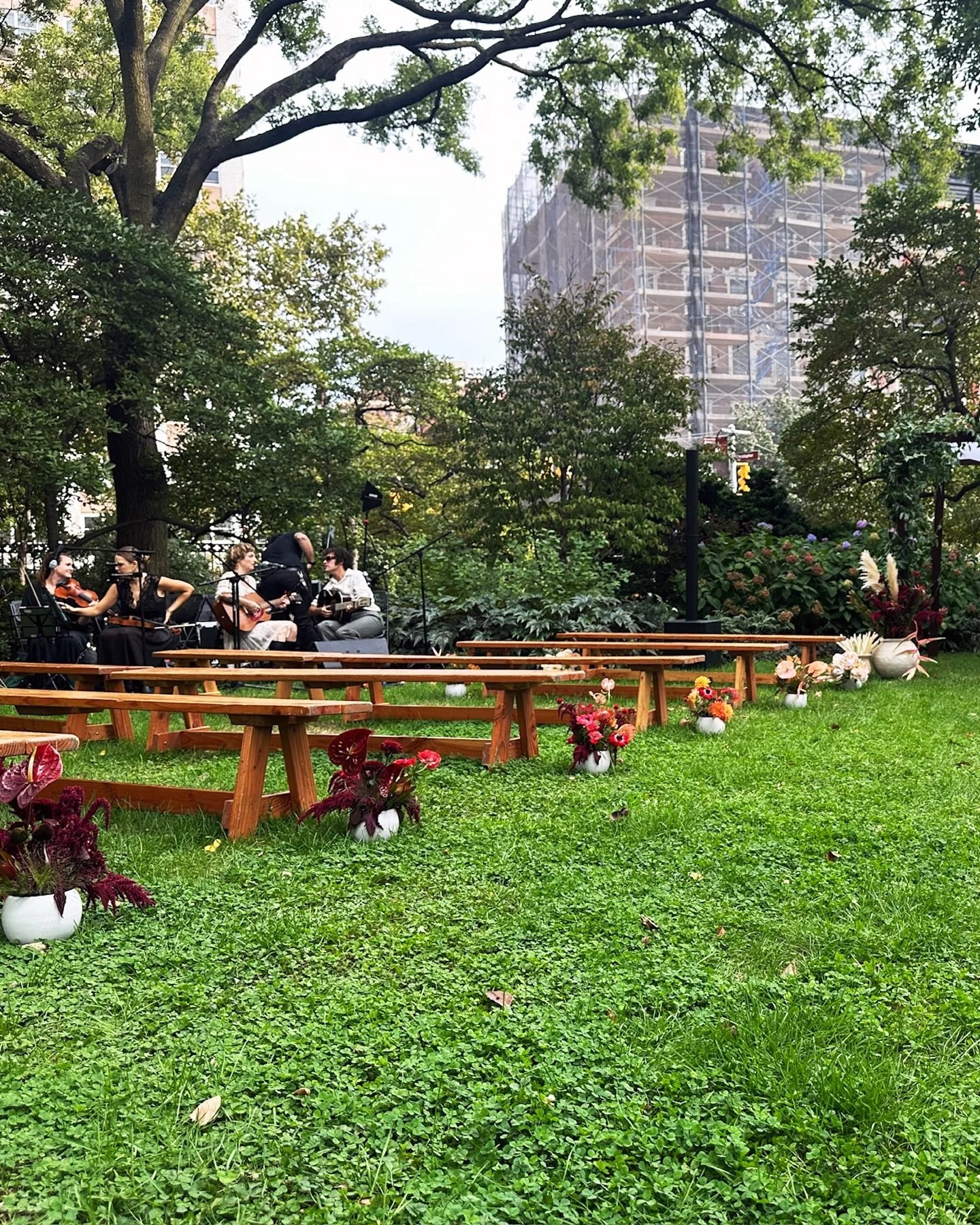 For the ceremony, we dreamed up an ombr&eacute; floral moment that moved from deep, moody tones to soft, warm hues down the aisle. The gradient brought a sense of movement and color that felt perfectly at home in the NYC garden setting.

At the recep