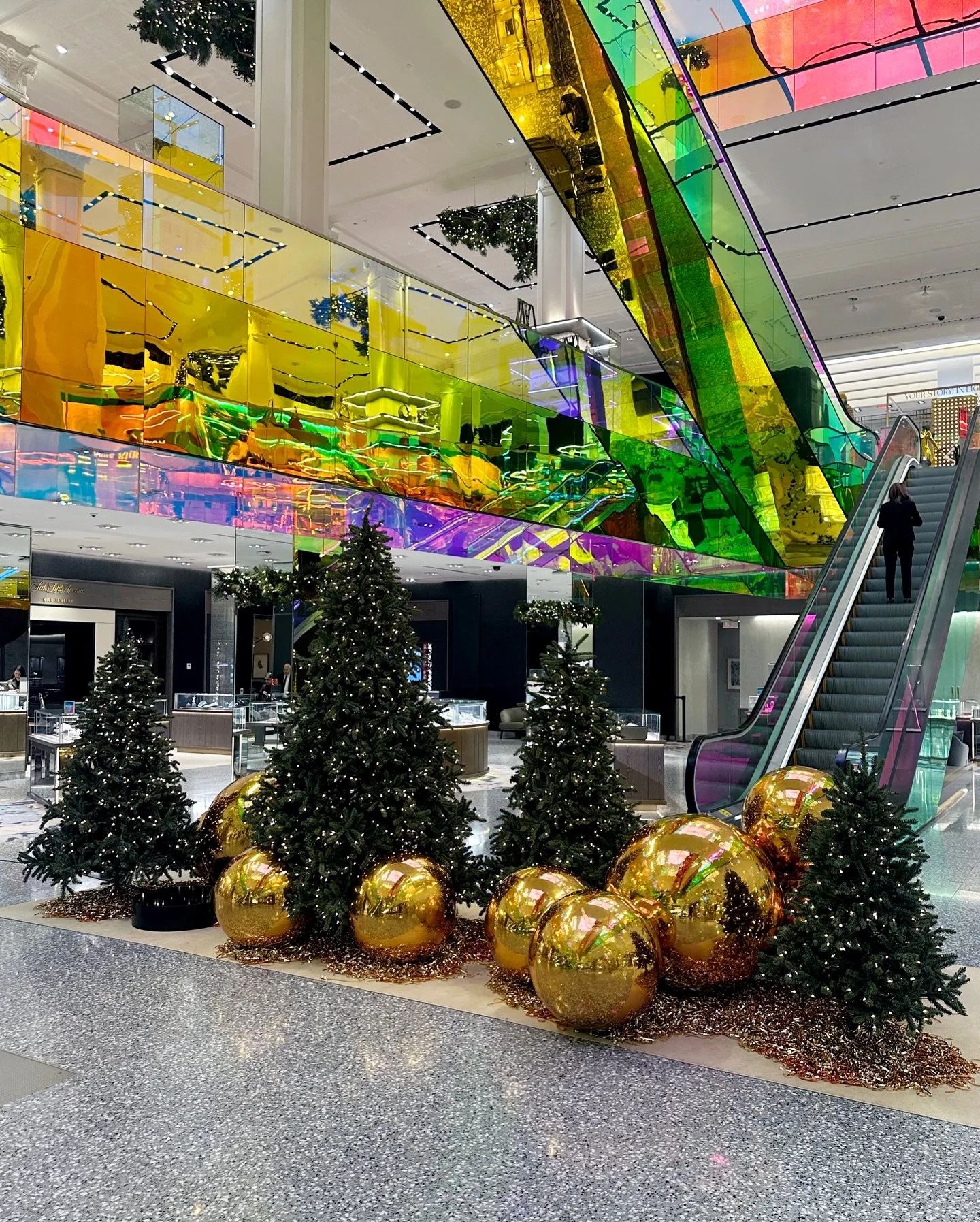Proud to collaborate with @foamcreativeagency on this holiday installation for Saks Fifth Avenue. 
Our scope included two signature spaces: a festive escalator base with lit trees and oversized gold ornaments, and a sculptural gold mylar wall in the 