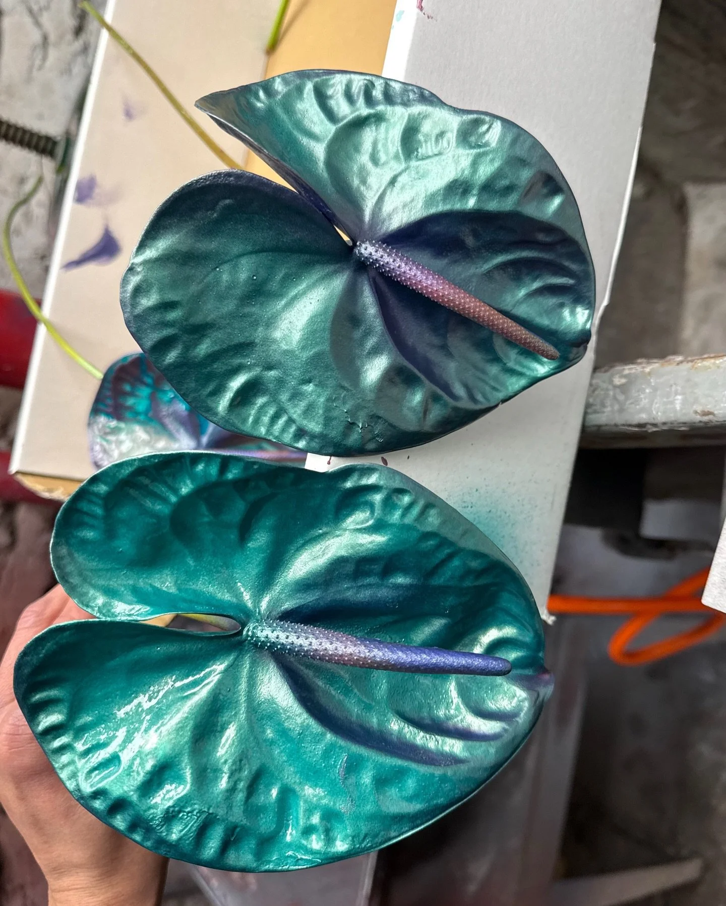 Previous On&hellip;

From testing metallic and iridescent paints on living plants,
to a flower activation that stood empty before we could even photograph it.

Hand-mixing over ten shades of blue to land on the exact one.
Endless plays on paper &mdas