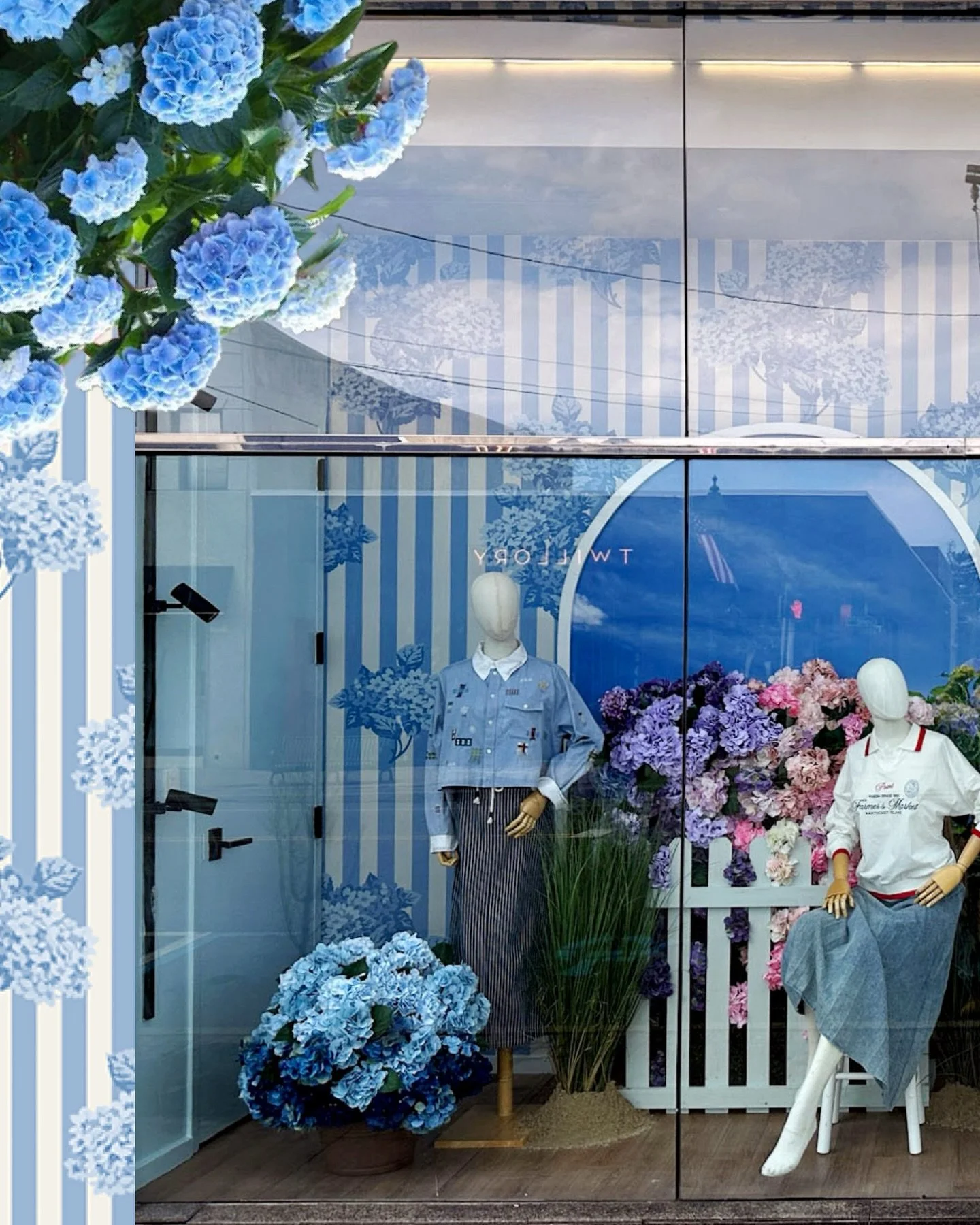Okay wait, I have to tell you about this window because we are kind of in love with how it turned out.  Nantucket in the summer&mdash;soft blues, tons of hydrangeas, that easy coastal vibe.  The wallpaper is actually completely custom, which set the 