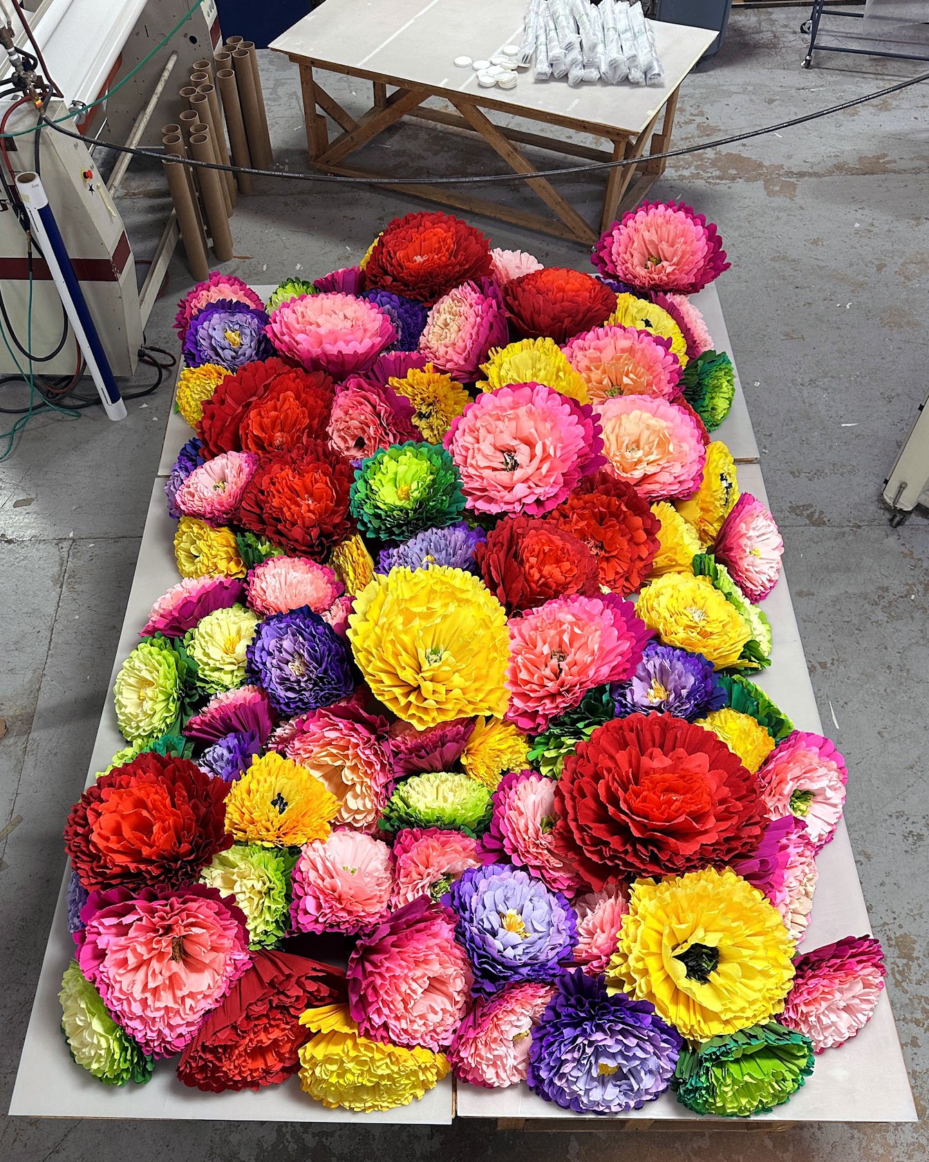 Table of over 100 hand made Crepe Flowers by Nick Sizemore for Frances Valentine 