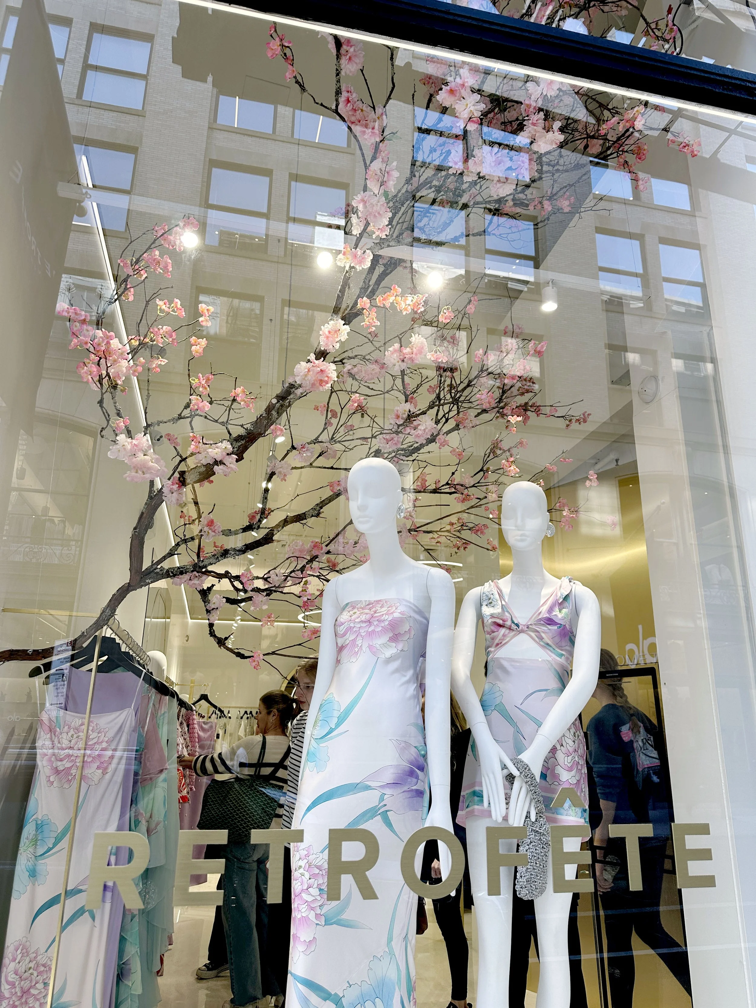 A real branch with faux flowers, constructed custom for the window design for Retro Fete