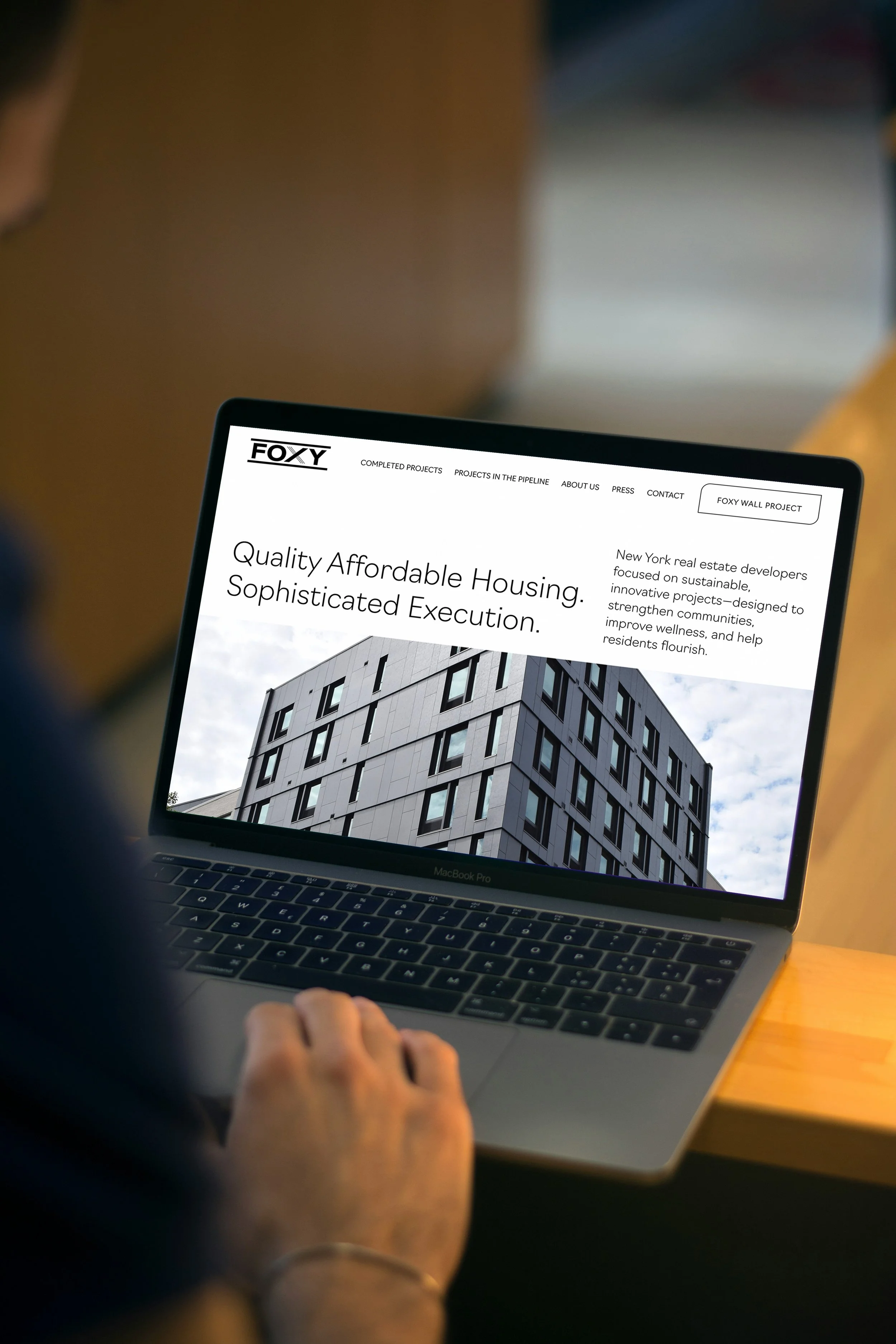 Mockup of a laptop with a website design by Up in a Day for a Development company. Websites for General Contractors, Independent Contractors, Builders, and Developers