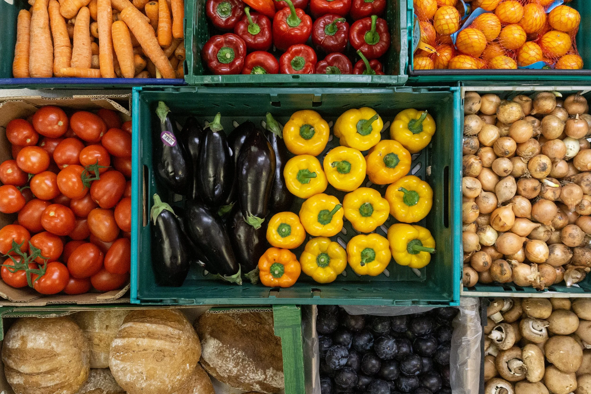 Open kitchen Food, top down view, creates of food, oranges, potatoes, peppers, tomatoes and bread