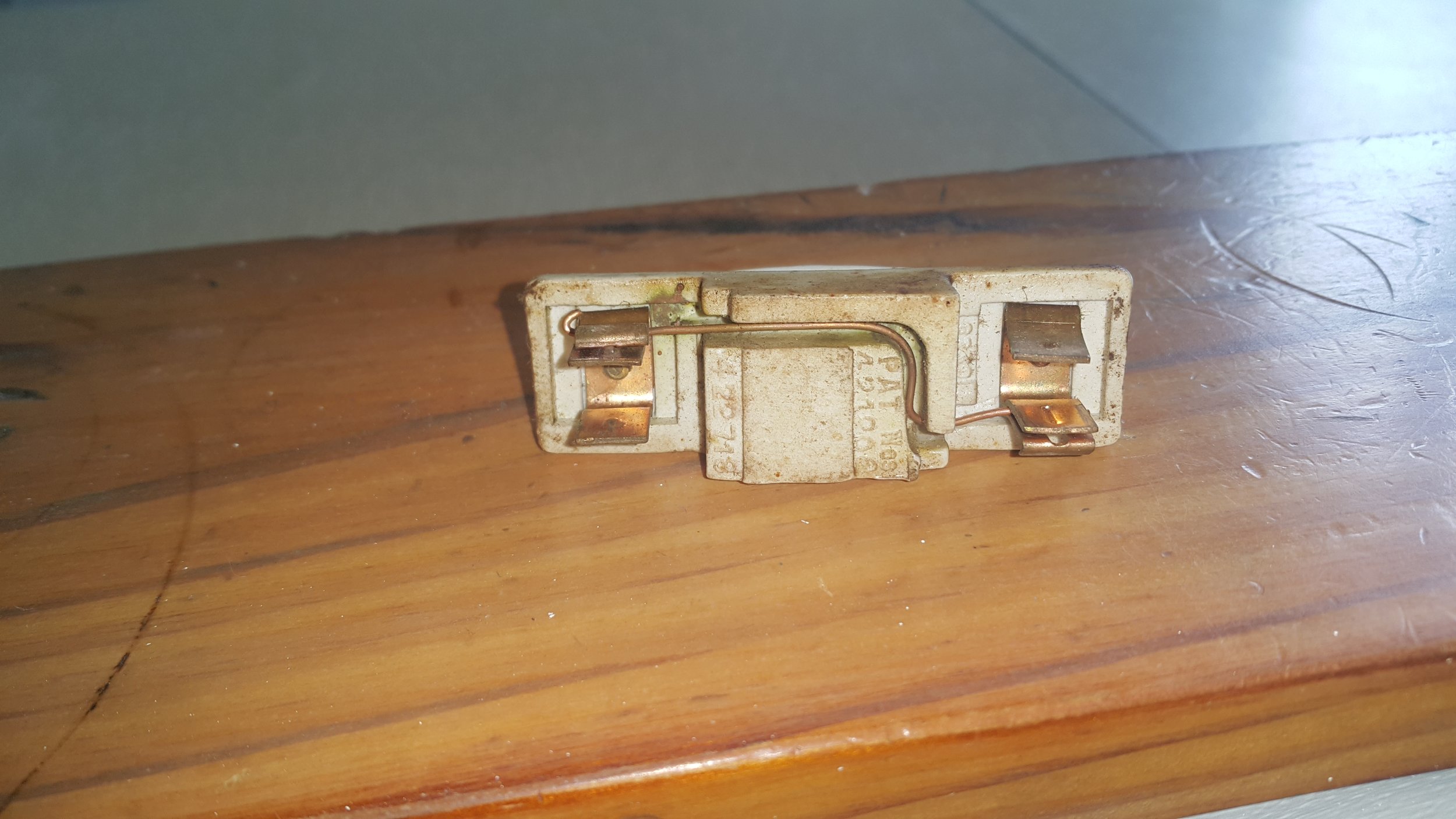 Fuse kept blowing so the owner put in a solid chunk of copper. The power circuit was overloaded and had melted and shorted out the service fuse out on the street. Fortunately the street fuse blew before it started a fire but not before damaging othe
