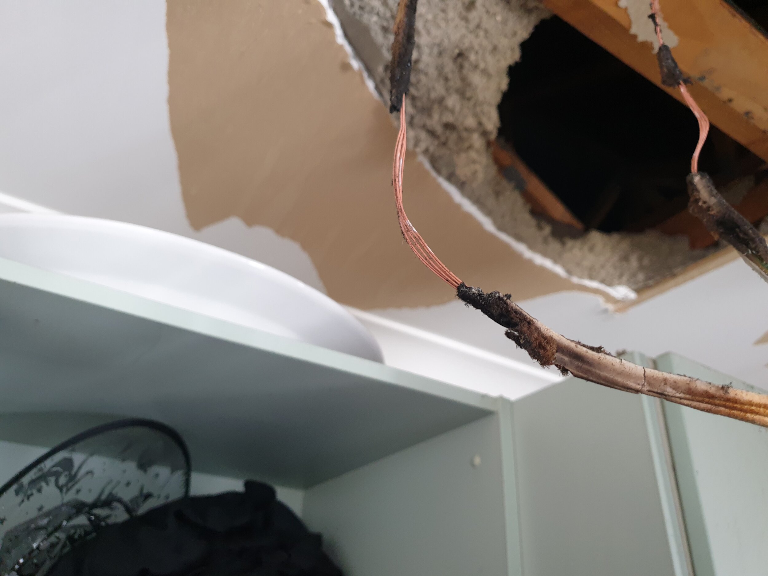 Incorrectly installed downlight caused fire.