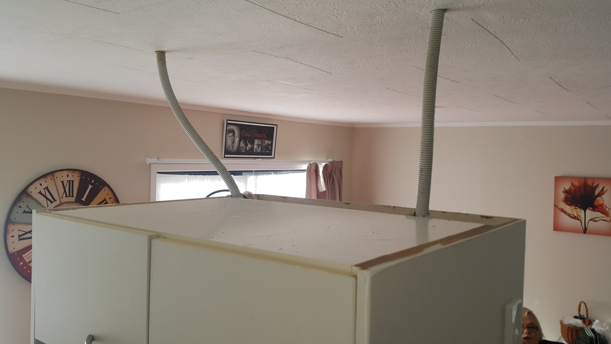 Outlets and lights installed in a flimsy MDF cupboard.