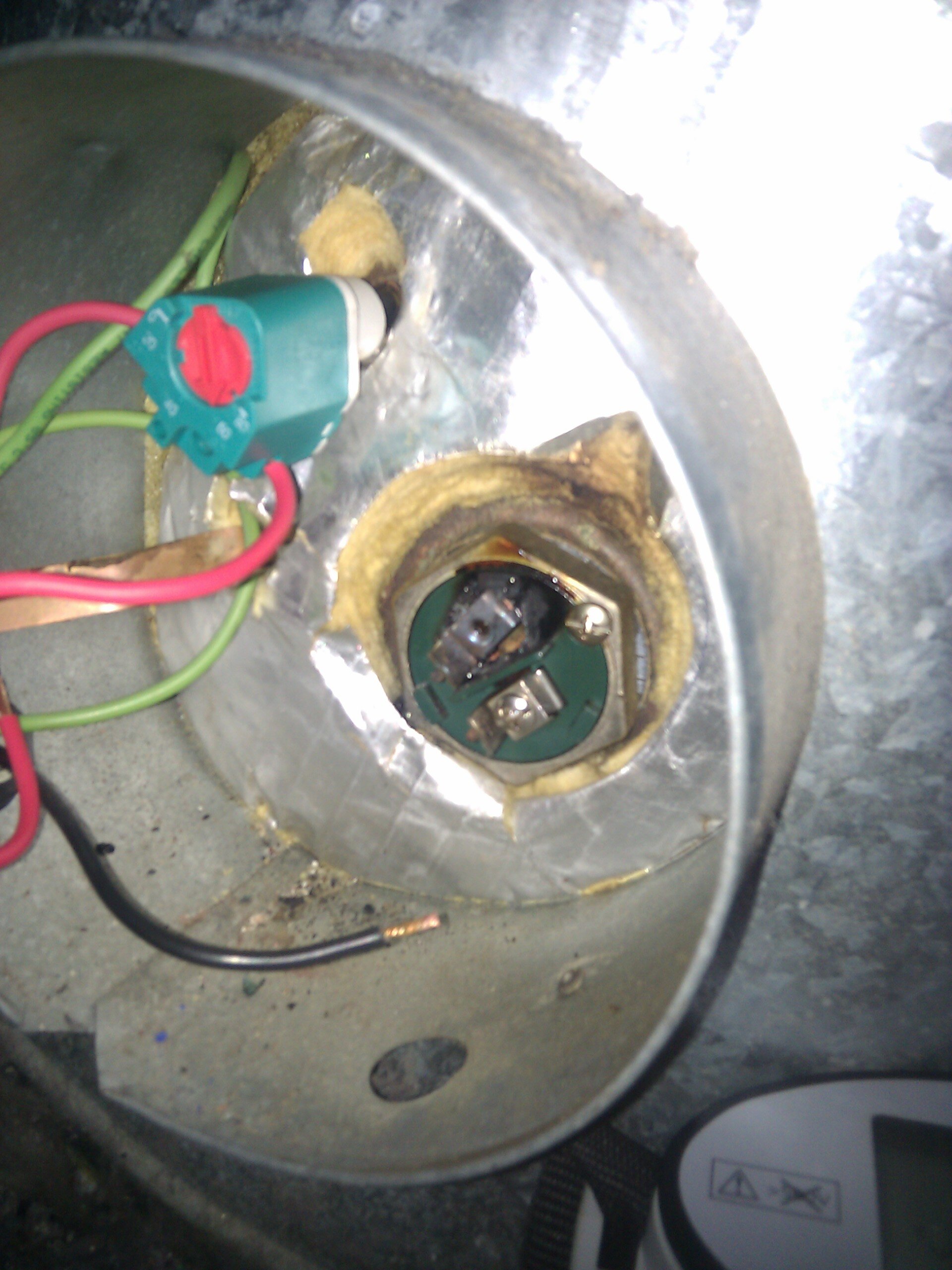 Hot water element where the neutral was loose causing it to arc and eventually fail.