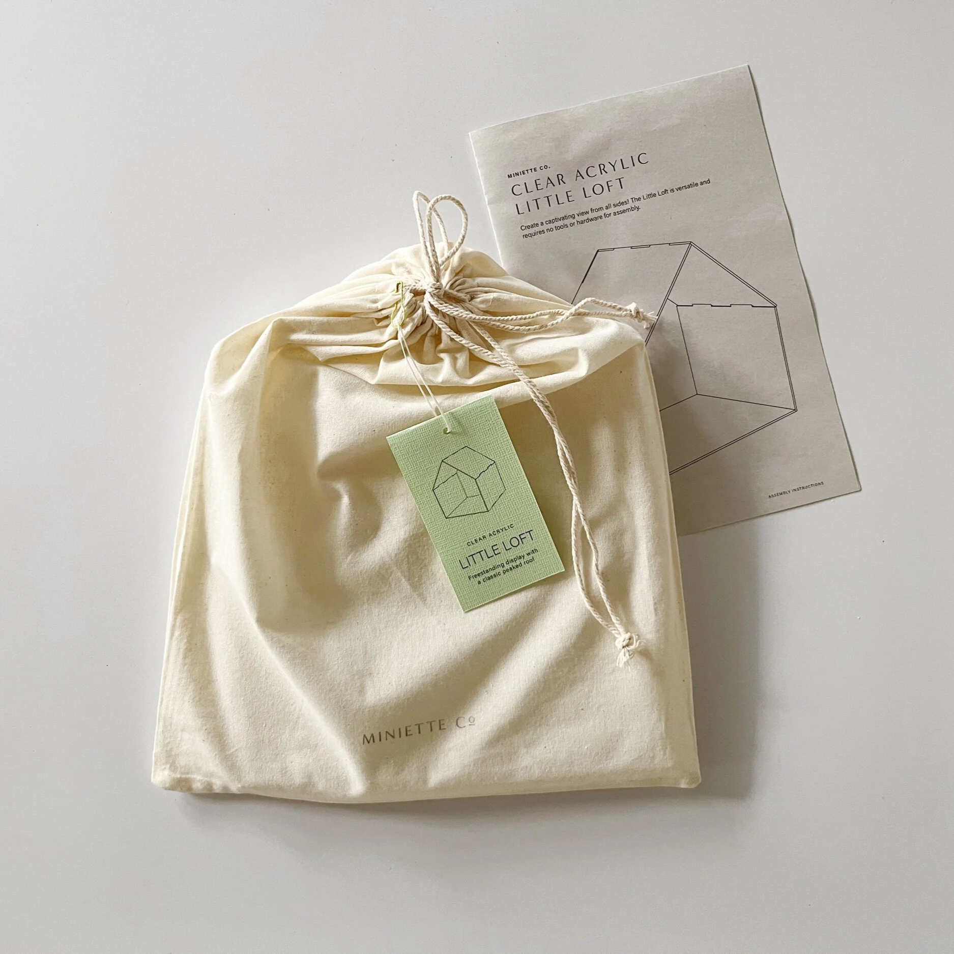 Clear acrylic miniature house display with pitched roof, designed as the Clear Little Loft for 1:12 scale interiors