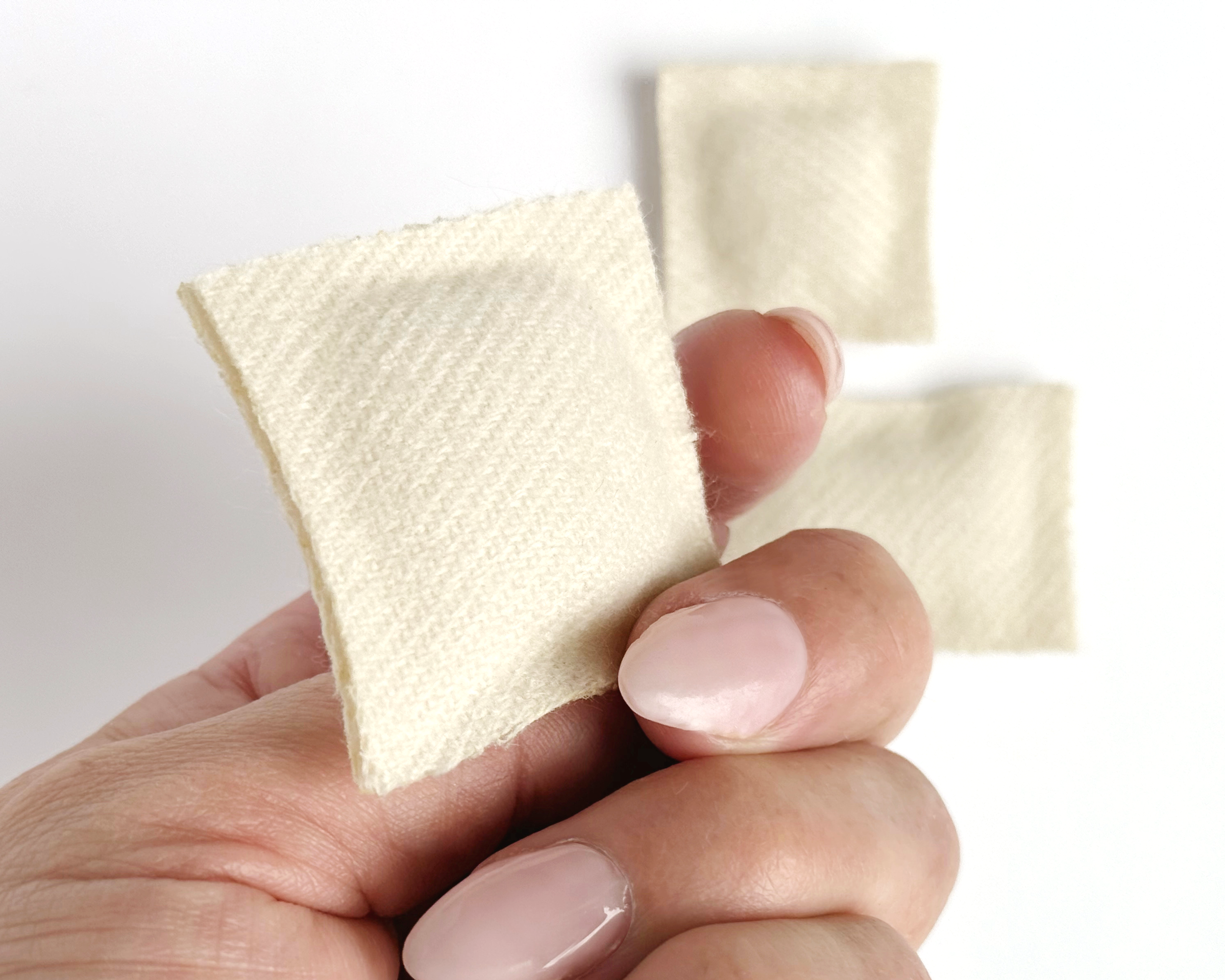 Set of 3 miniature dollhouse throw pillows in 1:12 scale. Handmade solid woven acrylic pillows in ivory.