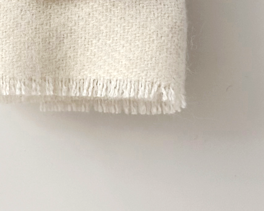 1:12 scale miniature dollhouse throw blanket in ivory, terra cotta, or royal currant. Handcrafted solid woven design with soft brushed fabric and fringed edge.