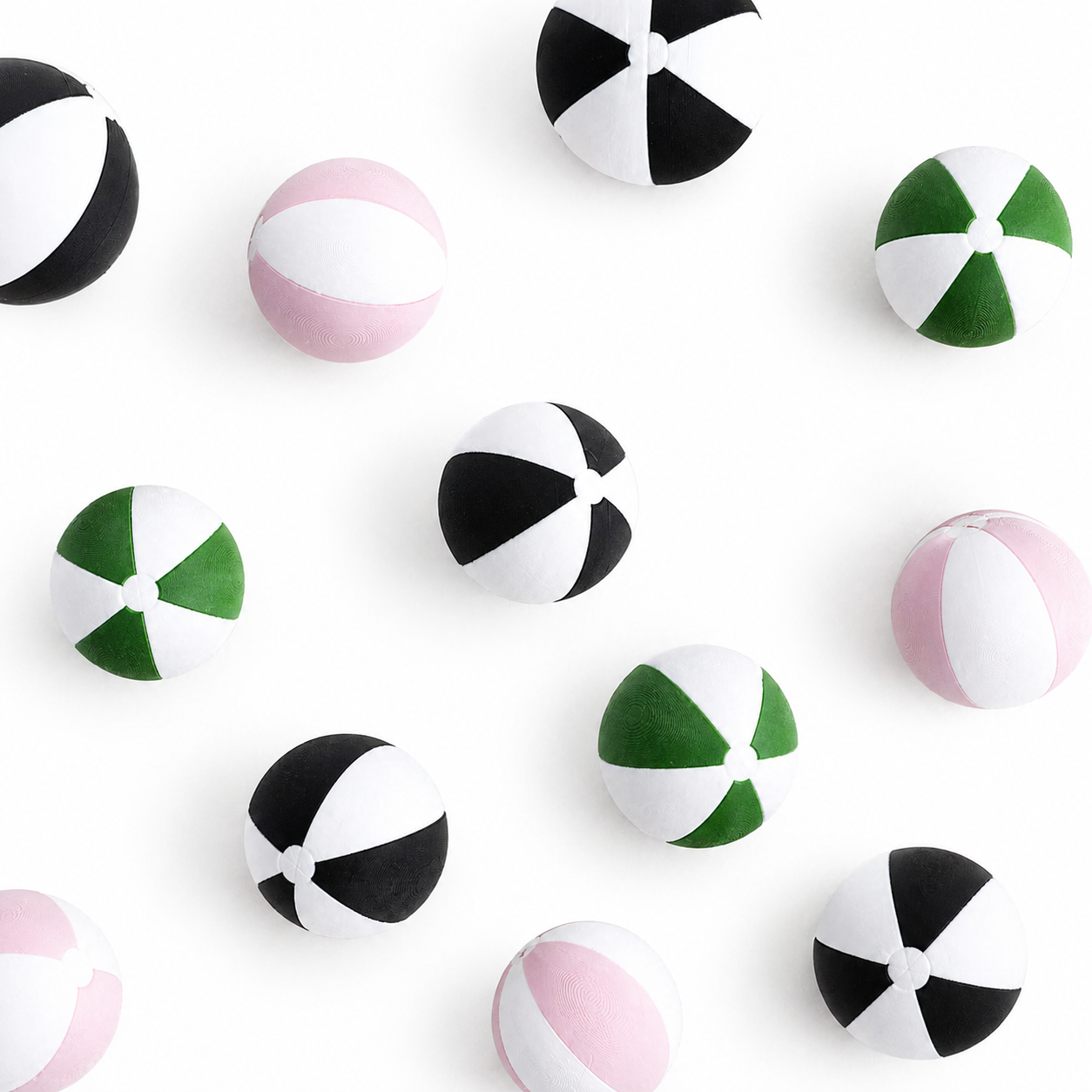 Miniature beach ball with striped design, styled on bright white background