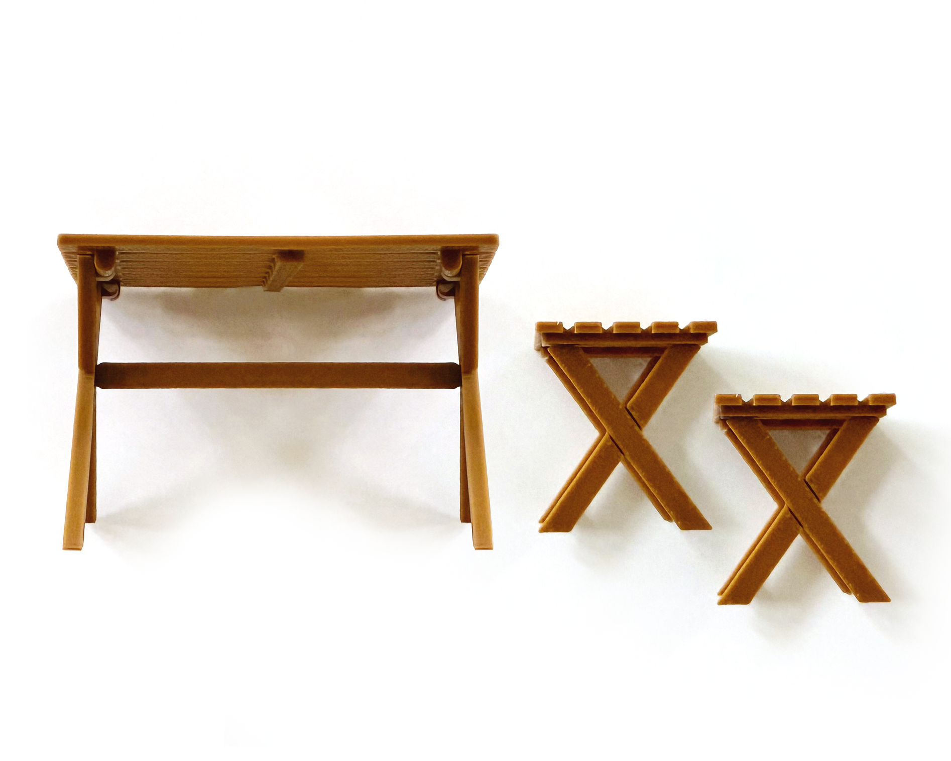 Flat lay of miniature folding camping table and stools