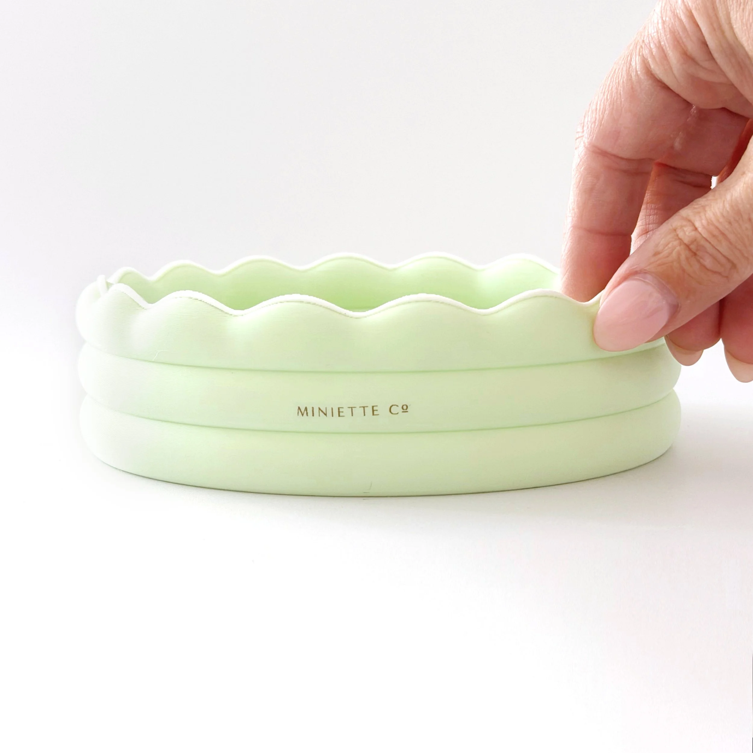 Angled view of the 1:12 scale kiddie pool highlighting its realistic depth and details.