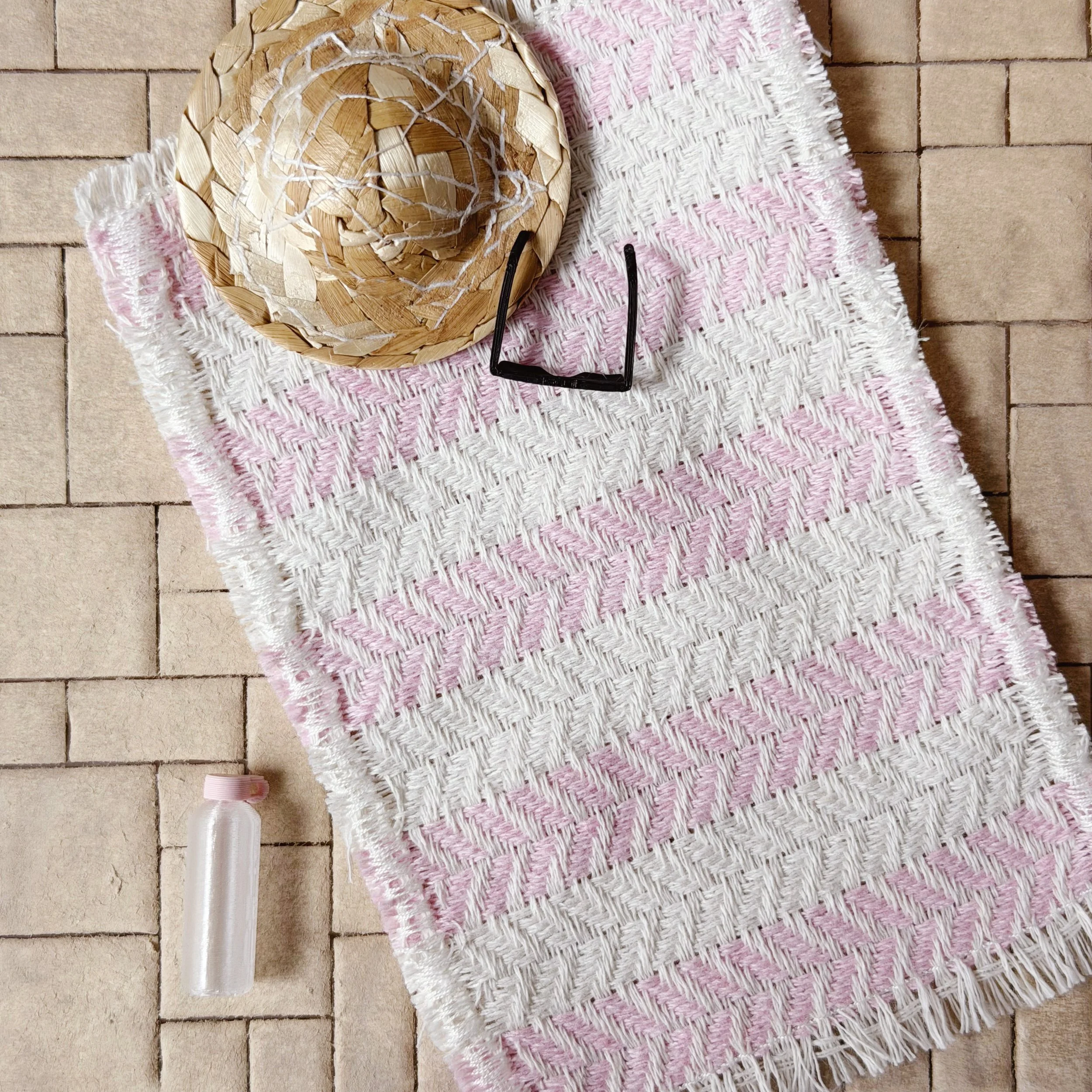 Dollhouse patio scene with striped beach towel and summer accessories