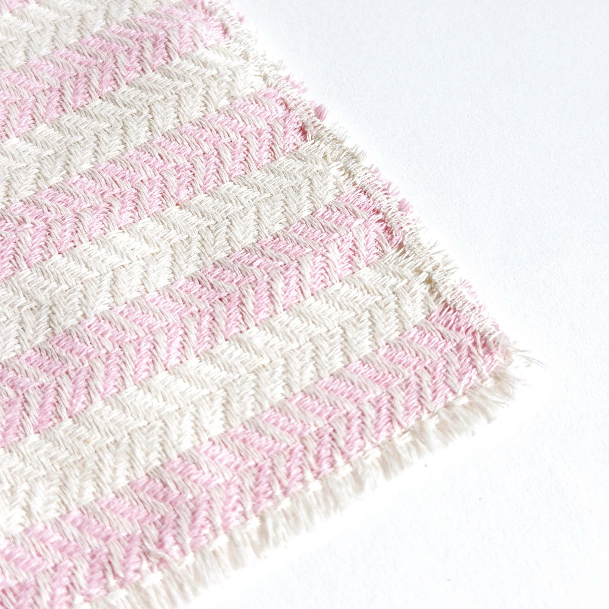 Close-up of pink striped miniature beach towel showing texture detail