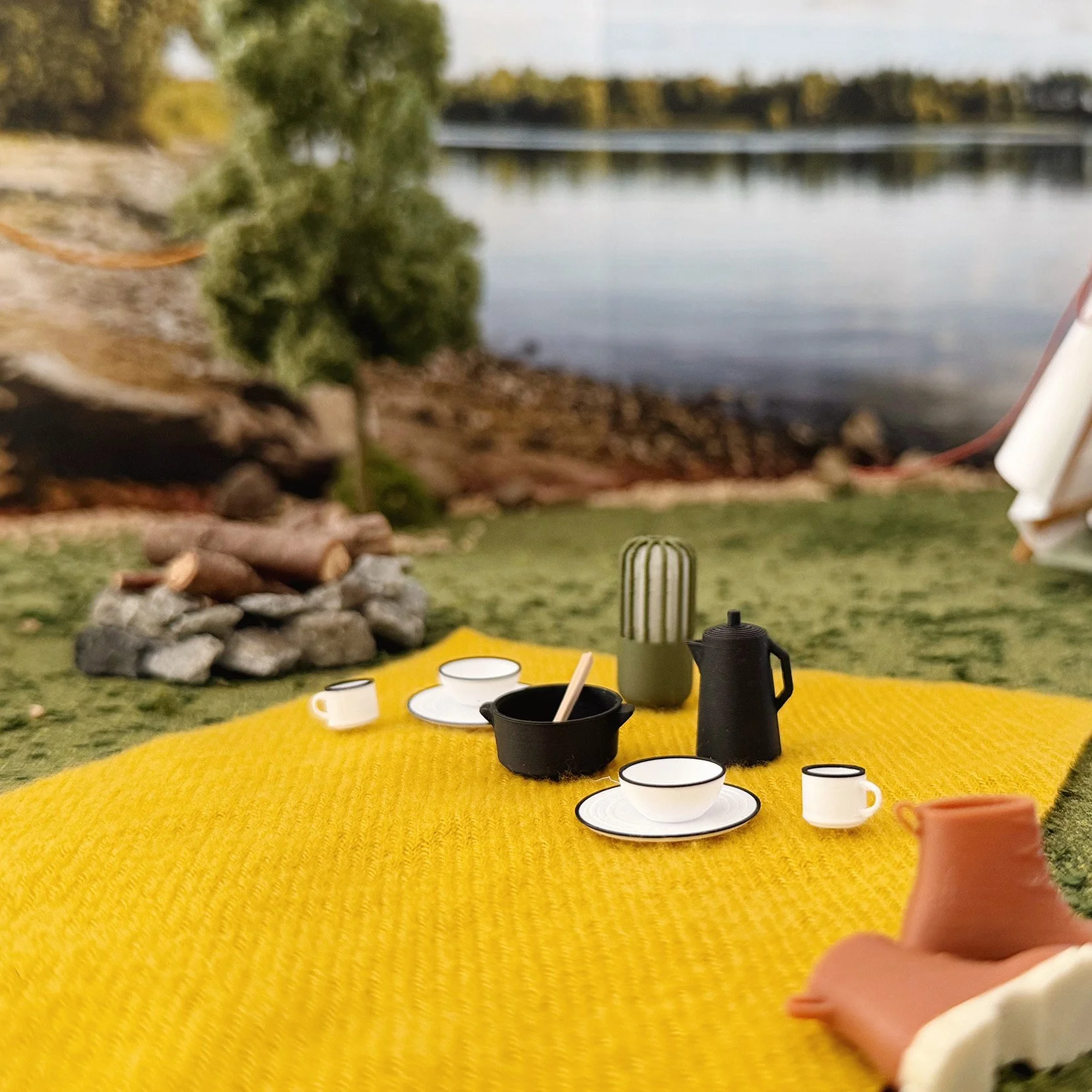 Miniature enamel dish set for a 1:12 scale dollhouse camping scene.