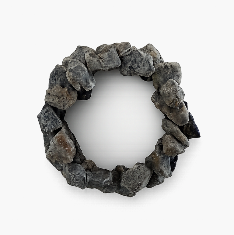 Dollhouse campfire made with natural stones on a white background.