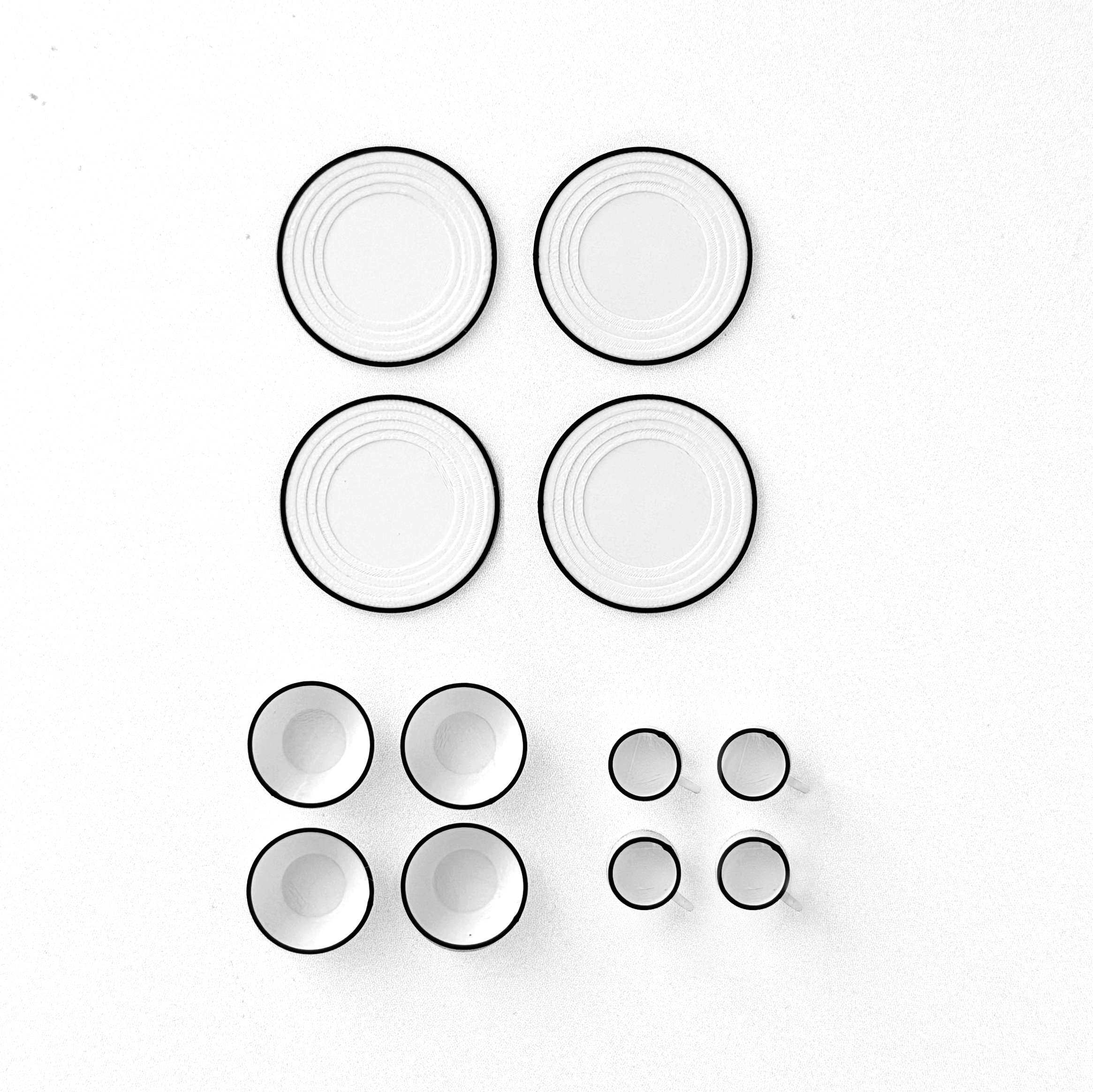 12-piece miniature camping dish set with classic enamel-inspired design.