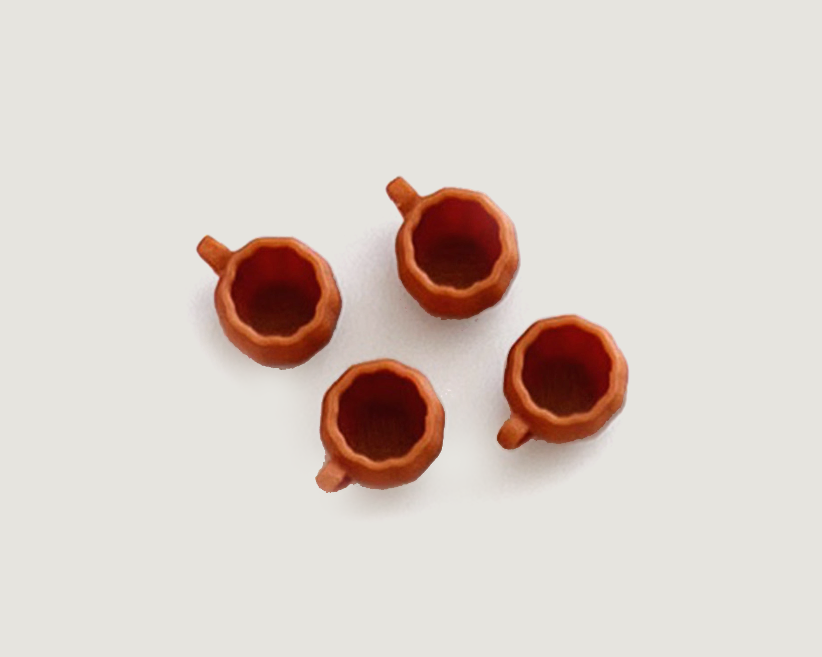 Mini pumpkin mugs for dollhouse fall décor. Set of four 1:12 scale plastic coffee cups, perfect for kitchens, shelves, or displays.