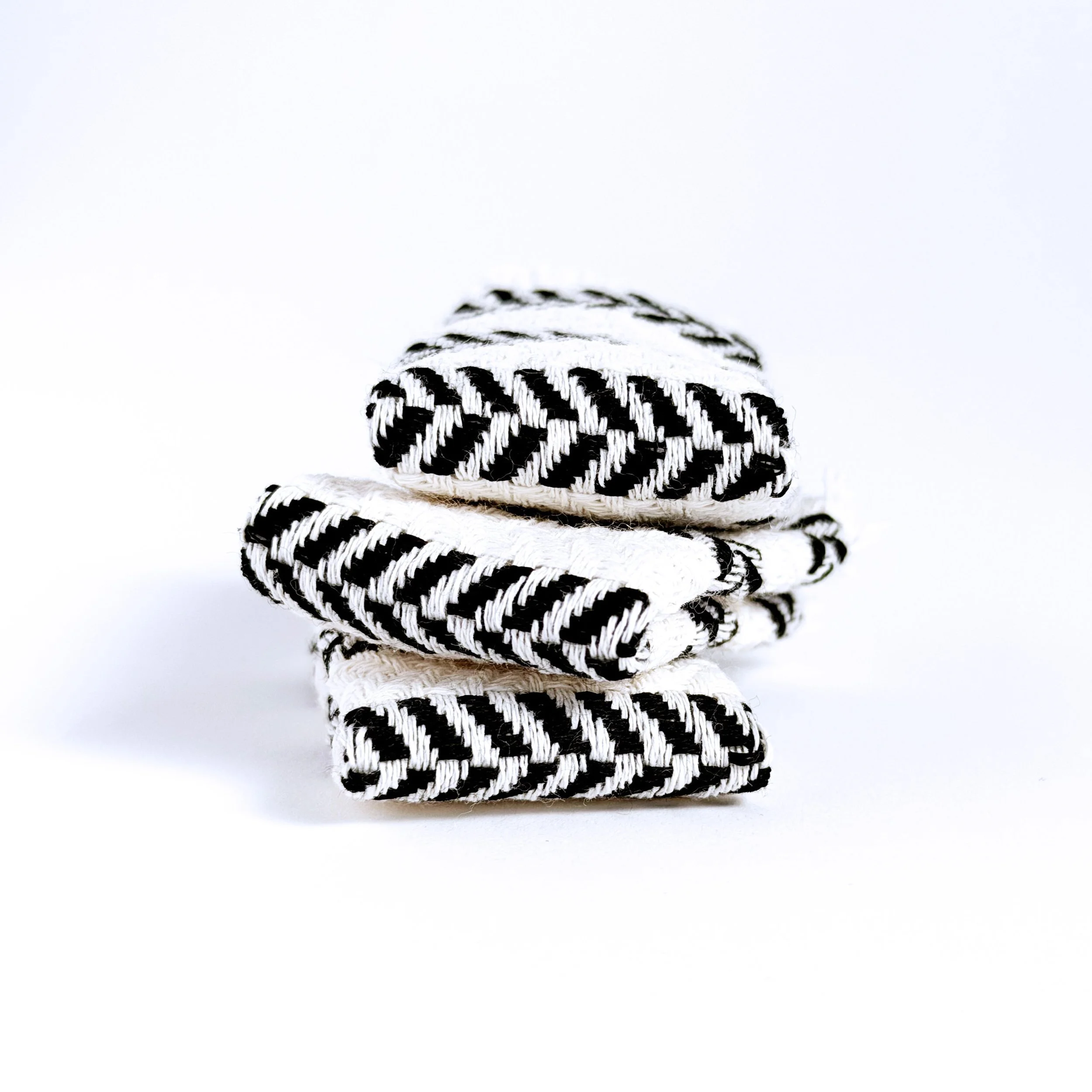 Miniature beach towel folded neatly on white background