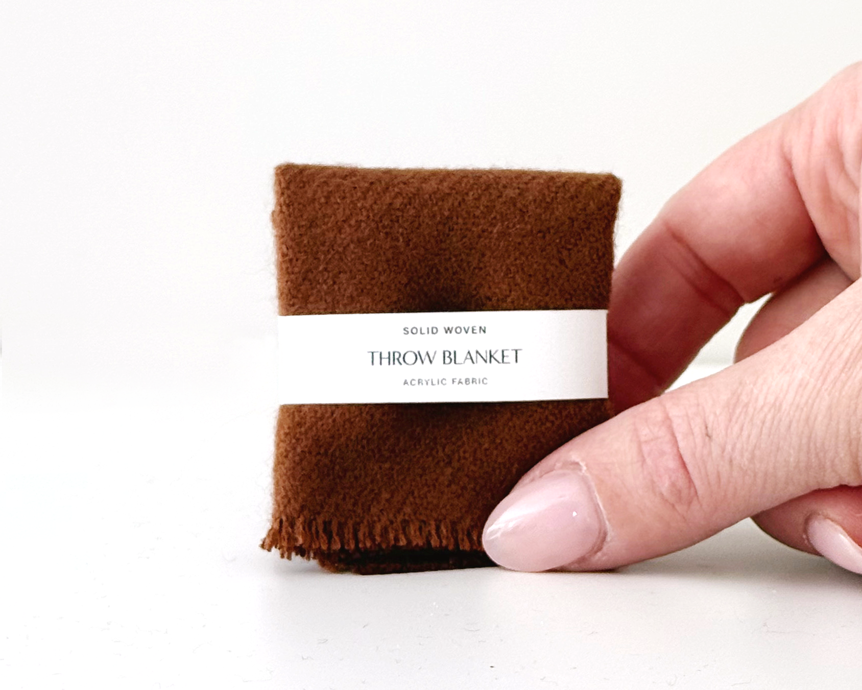 1:12 scale miniature dollhouse throw blanket in ivory, terra cotta, or royal currant. Handcrafted solid woven design with soft brushed fabric and fringed edge.