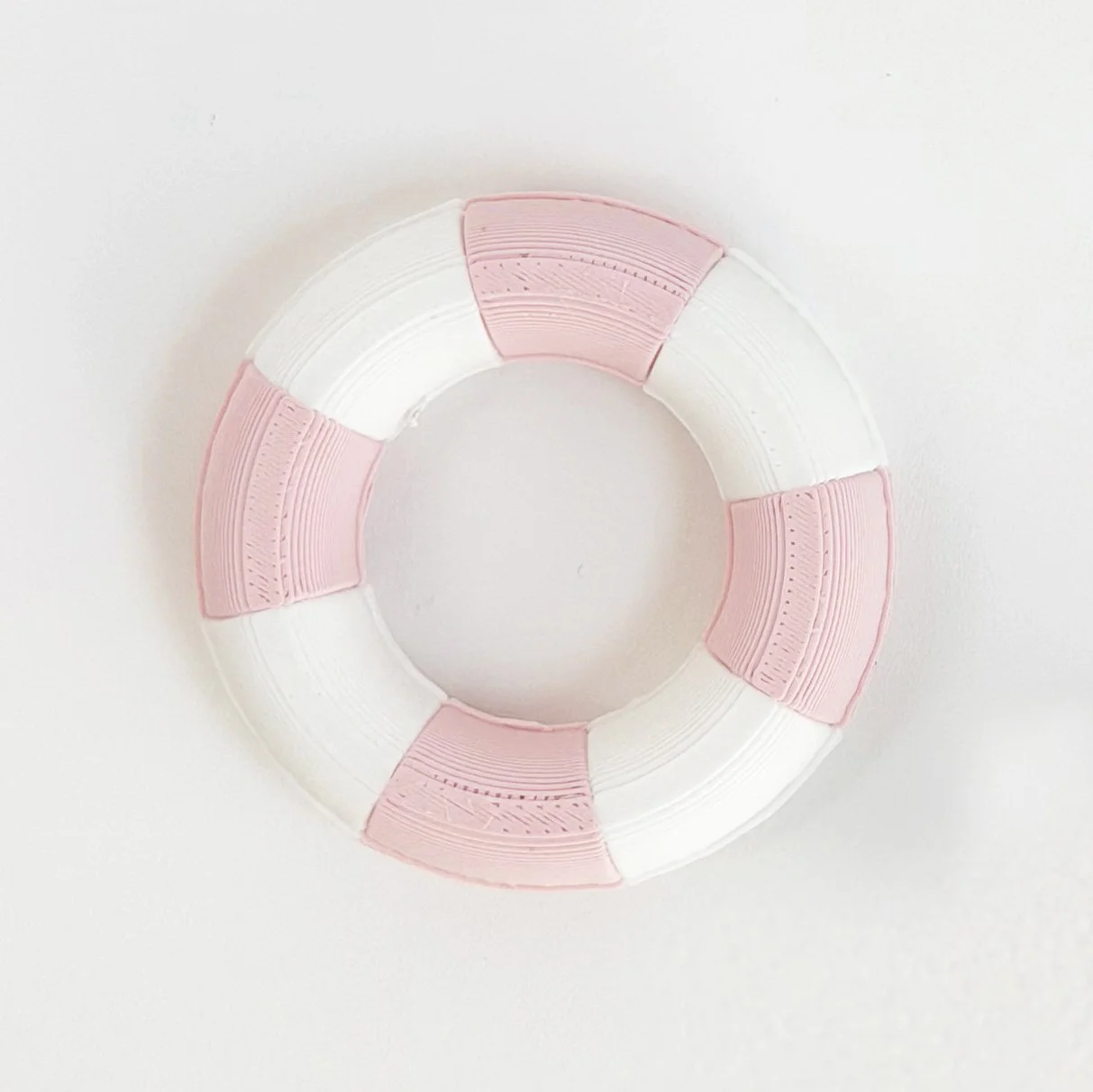 1:12 scale miniature pool float in pink and white stripe styled for dollhouse summer scene