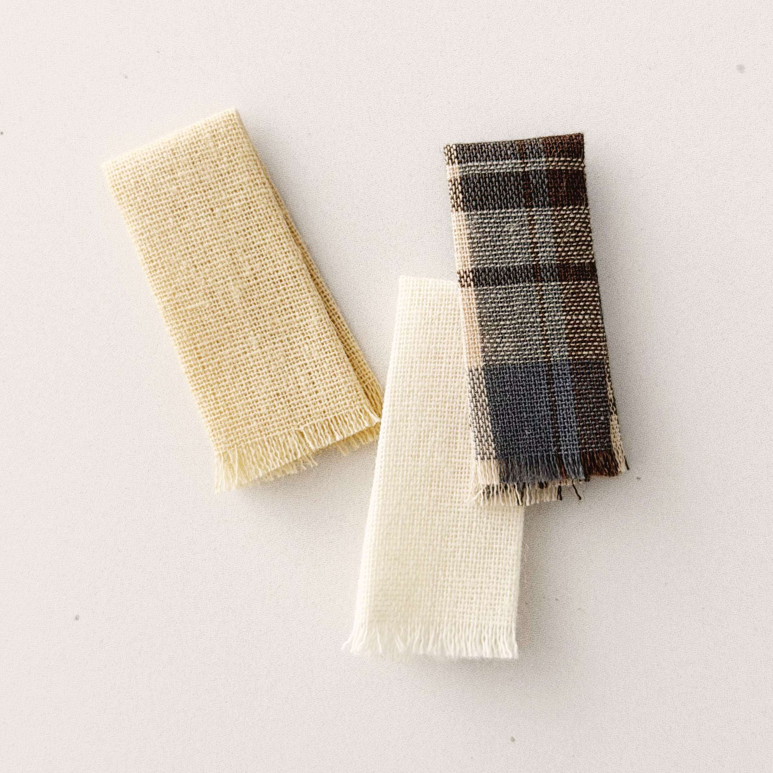 Miniature cutting board and folded towels styled for a cozy 1:12 scale kitchen