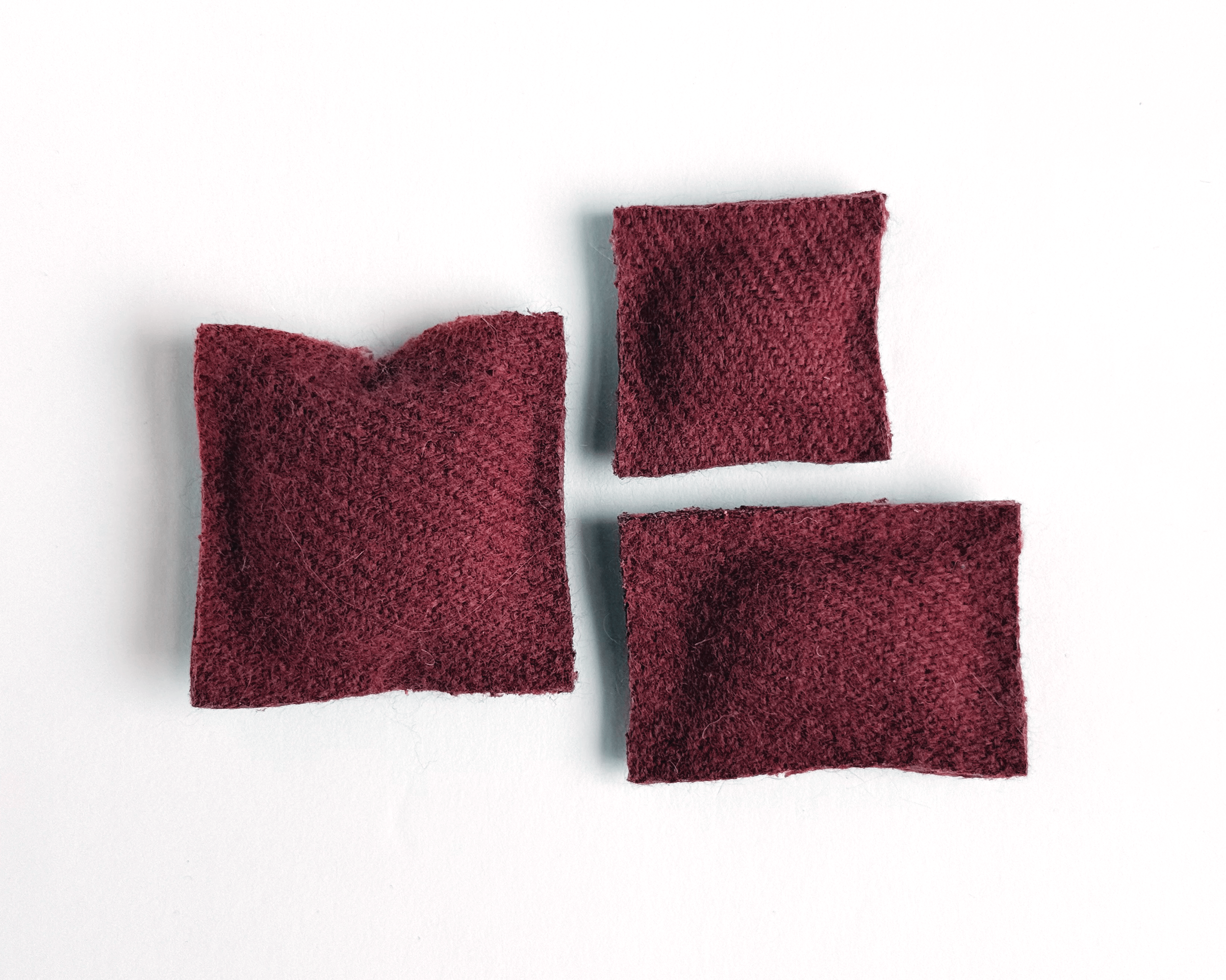 Set of 3 miniature dollhouse throw pillows in 1:12 scale. Handmade solid woven acrylic pillows in currant.