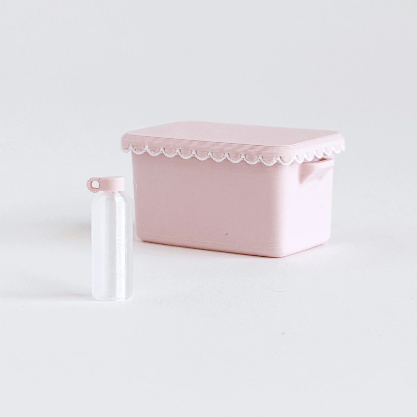 Pink dollhouse water bottle with simple, modern design