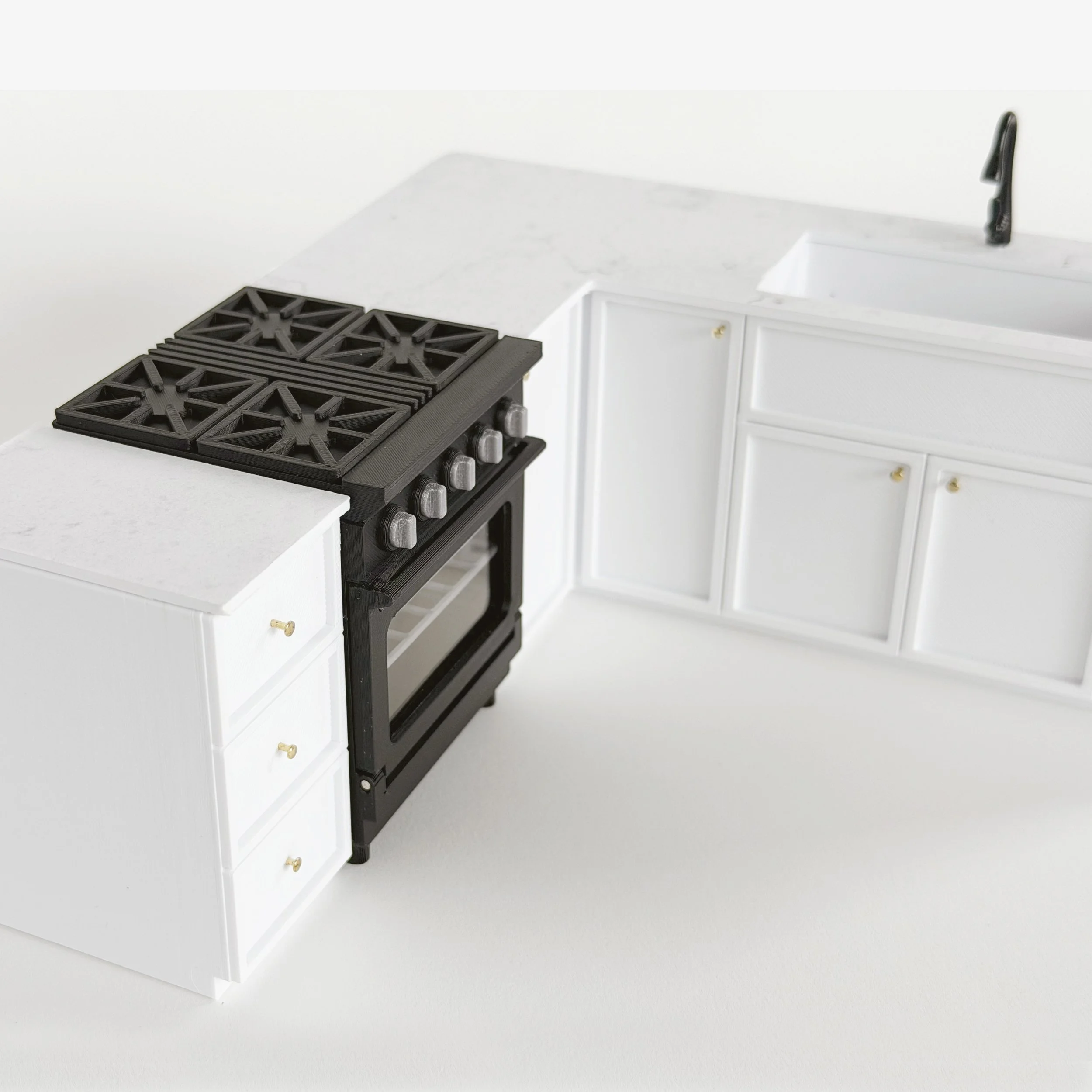 White 1:12 scale miniature kitchen cabinet and oven set in Shaker style, shown as a complete dollhouse kitchen layout. (Copy)