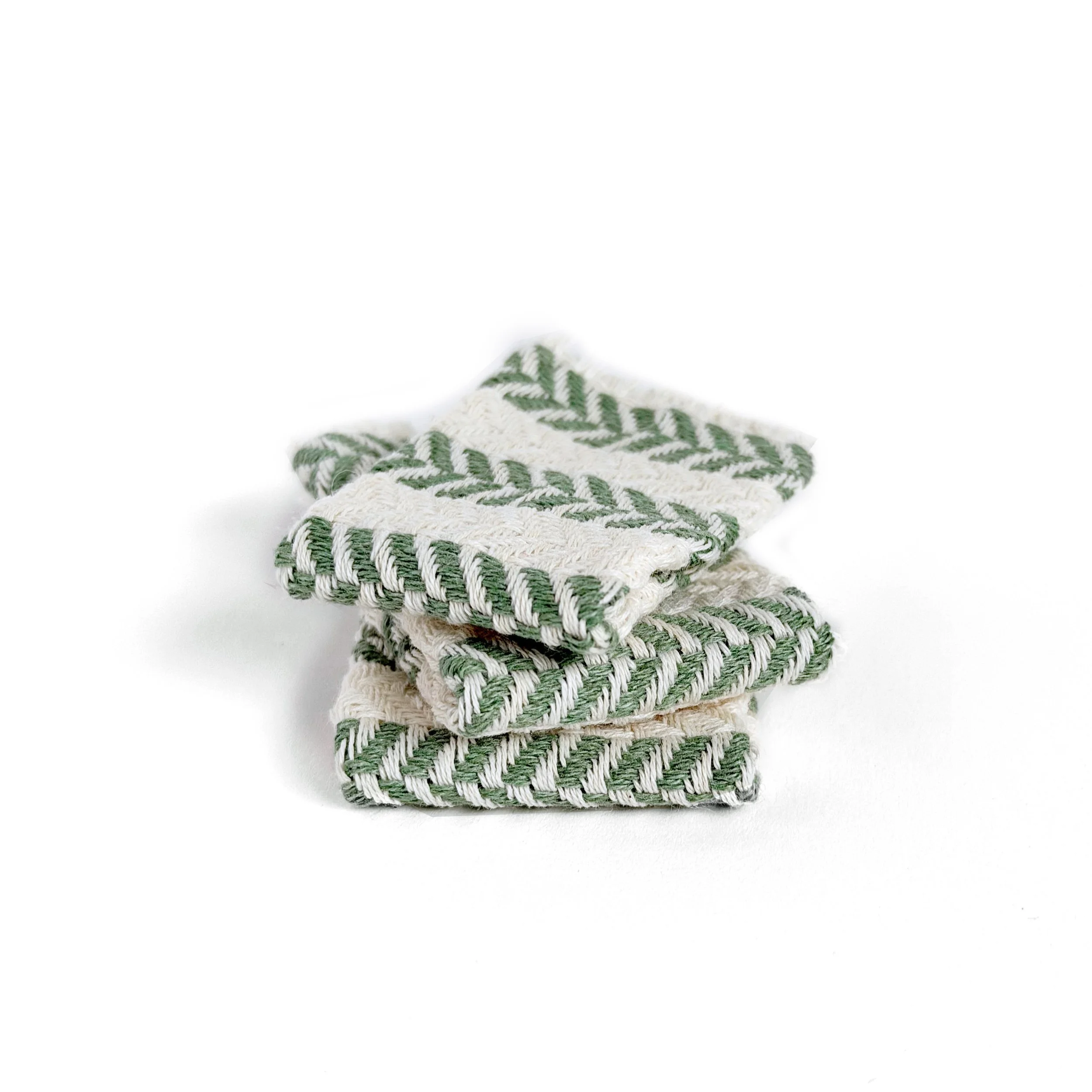 Miniature beach towel folded neatly on white background