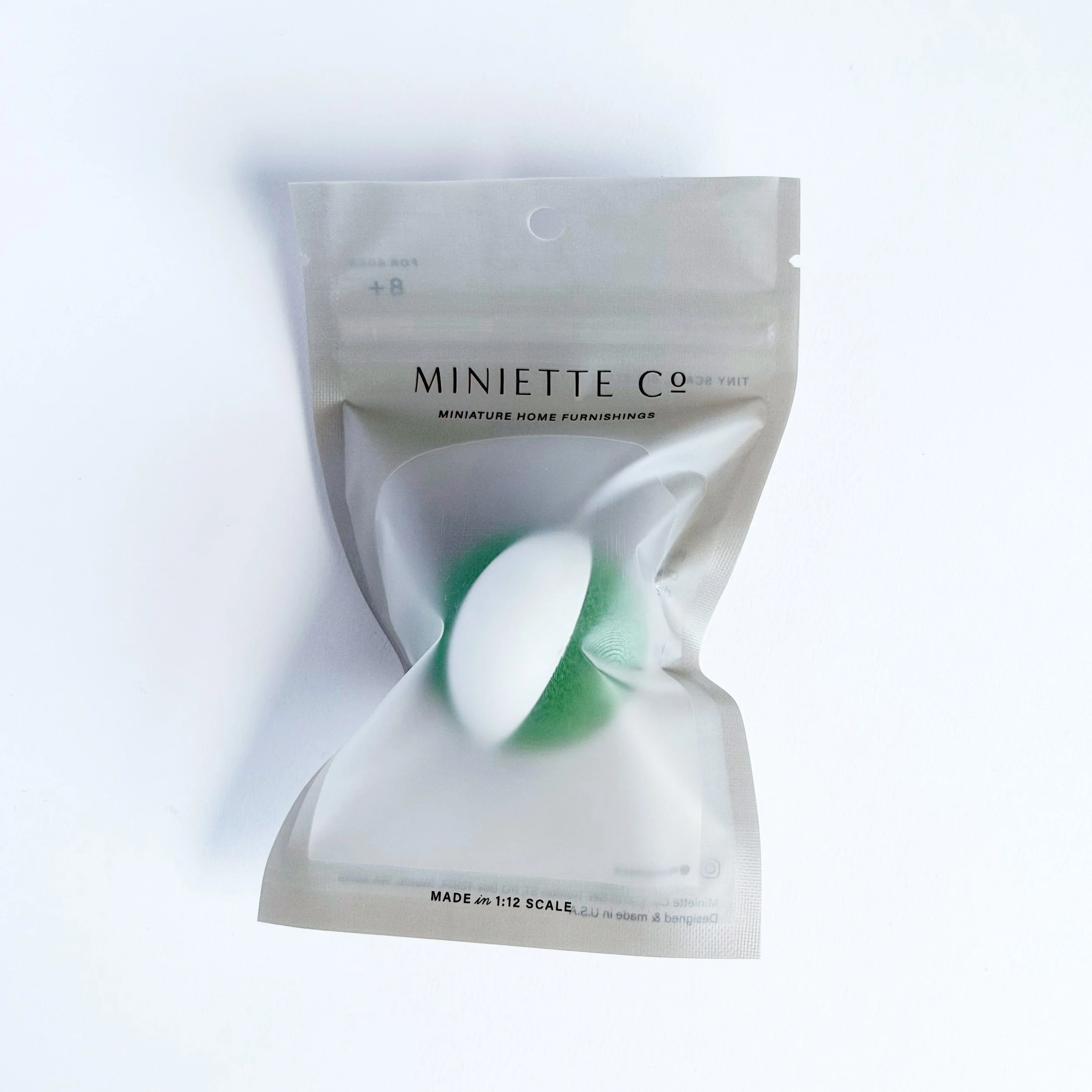 Close-up of green and white beach ball in 1:12 scale