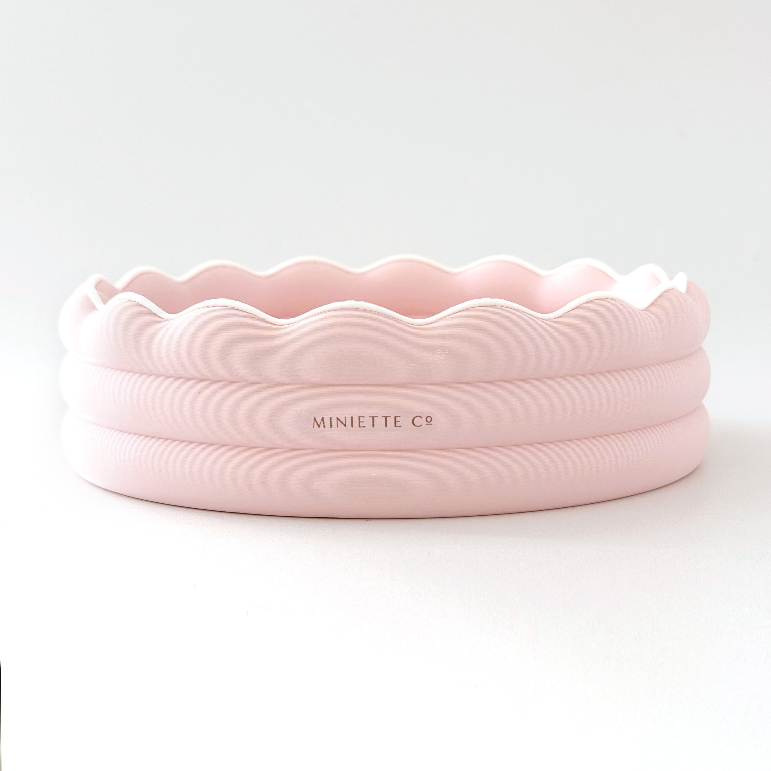 Modern 1:12 scale miniature kiddie pool on a white background.