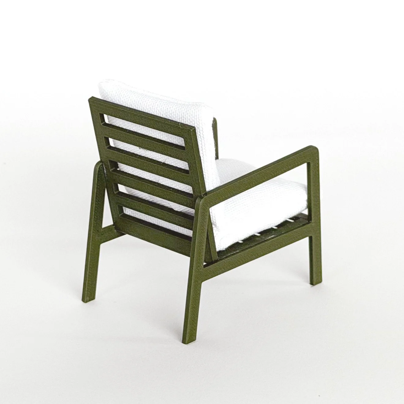 Close-up detail of miniature armchair showing smooth finish and structured design, 1:12 scale dollhouse furniture