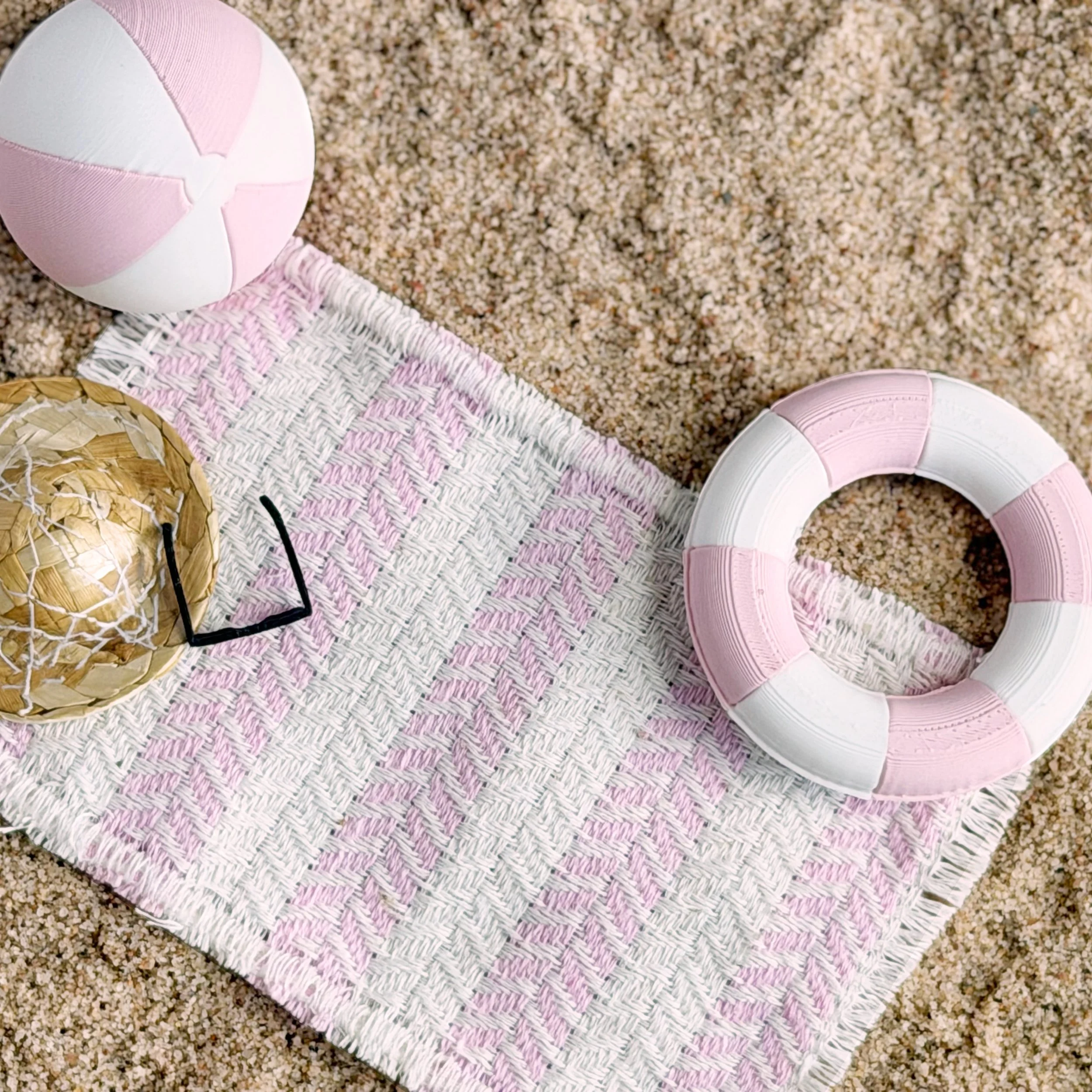 Close-up of pink and white miniature beach ball accessory
