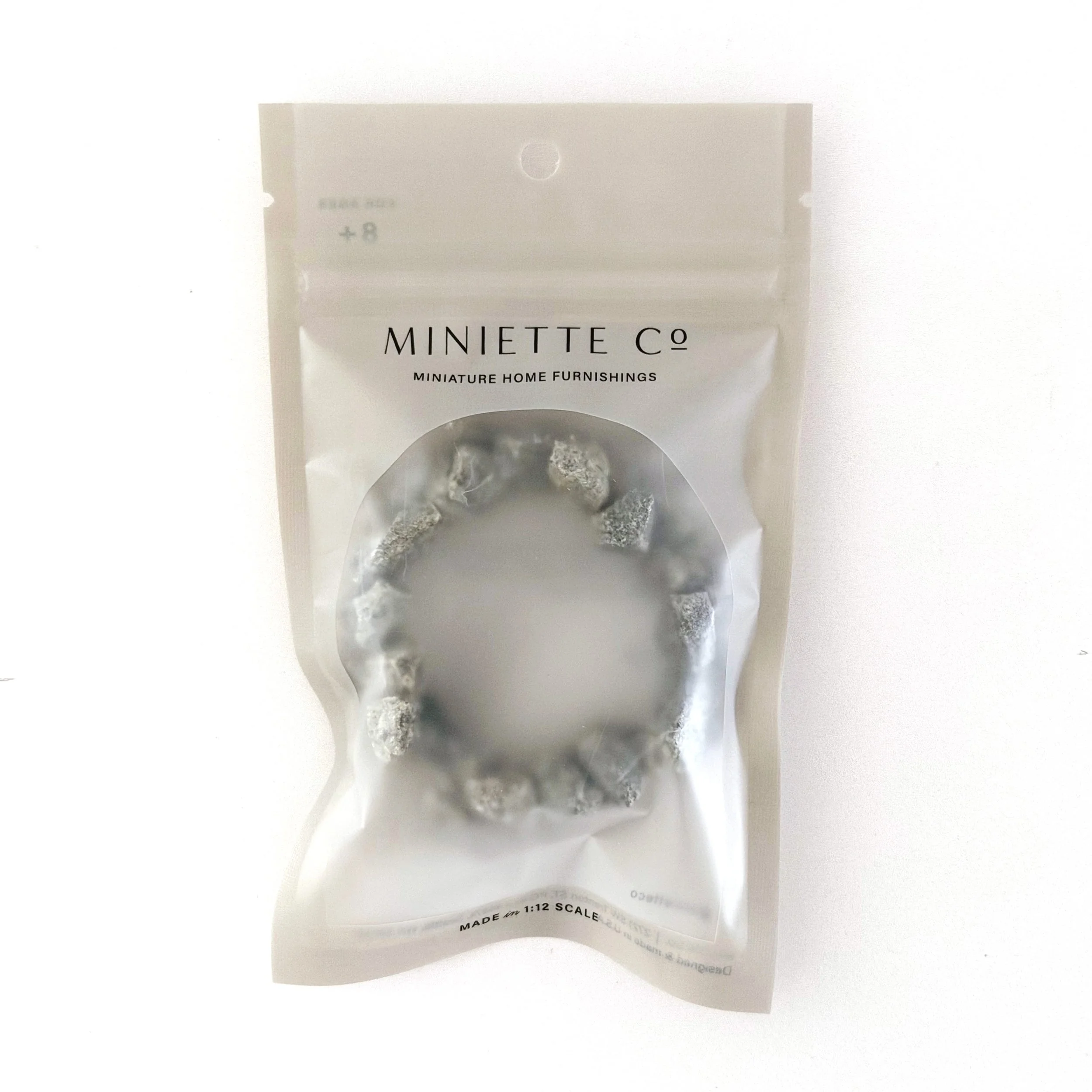 Decorative miniature campfire for dollhouses, dioramas, and outdoor displays.