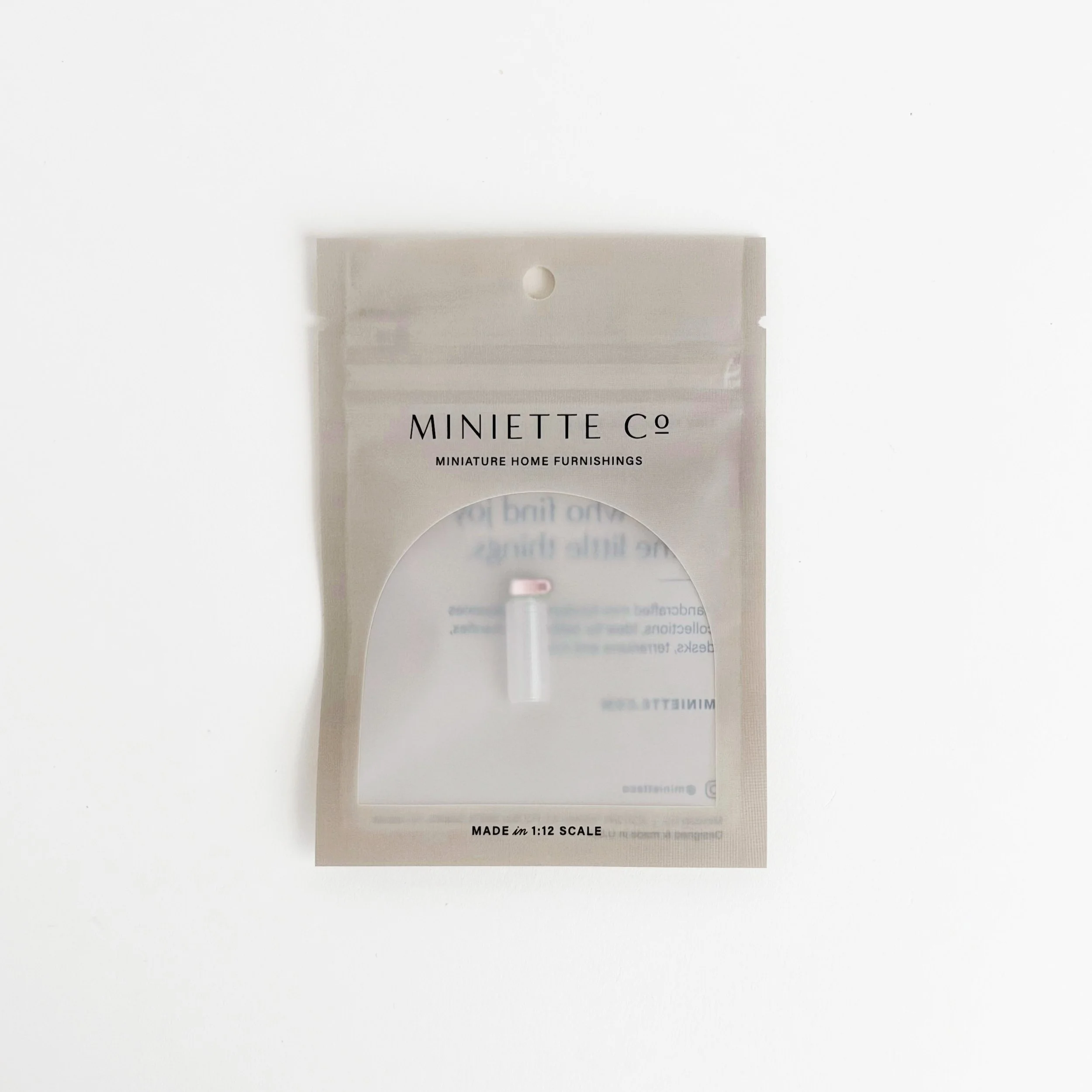 1:12 scale miniature pink water bottle on bright white background