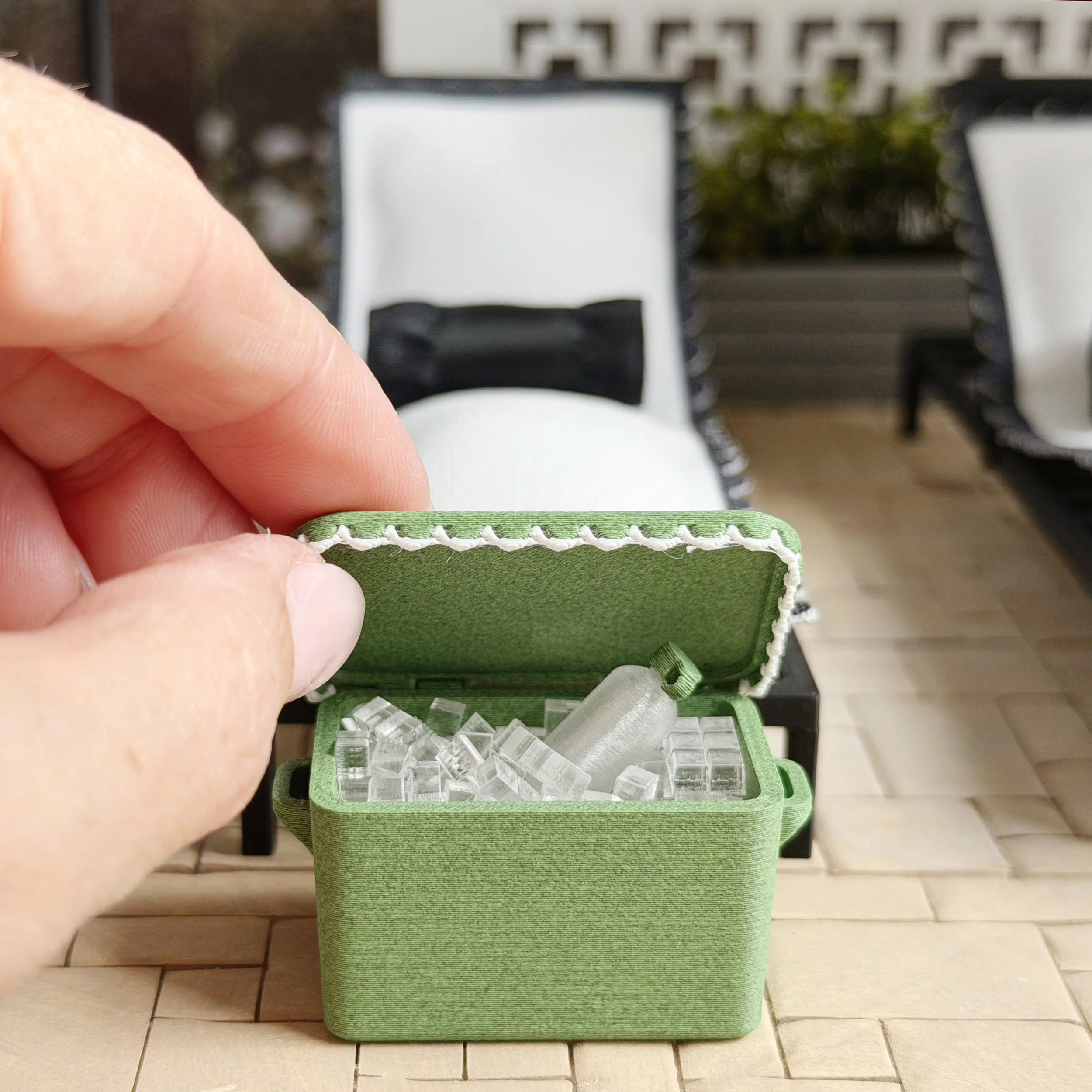 Dollhouse patio scene with water bottle as part of summer styling