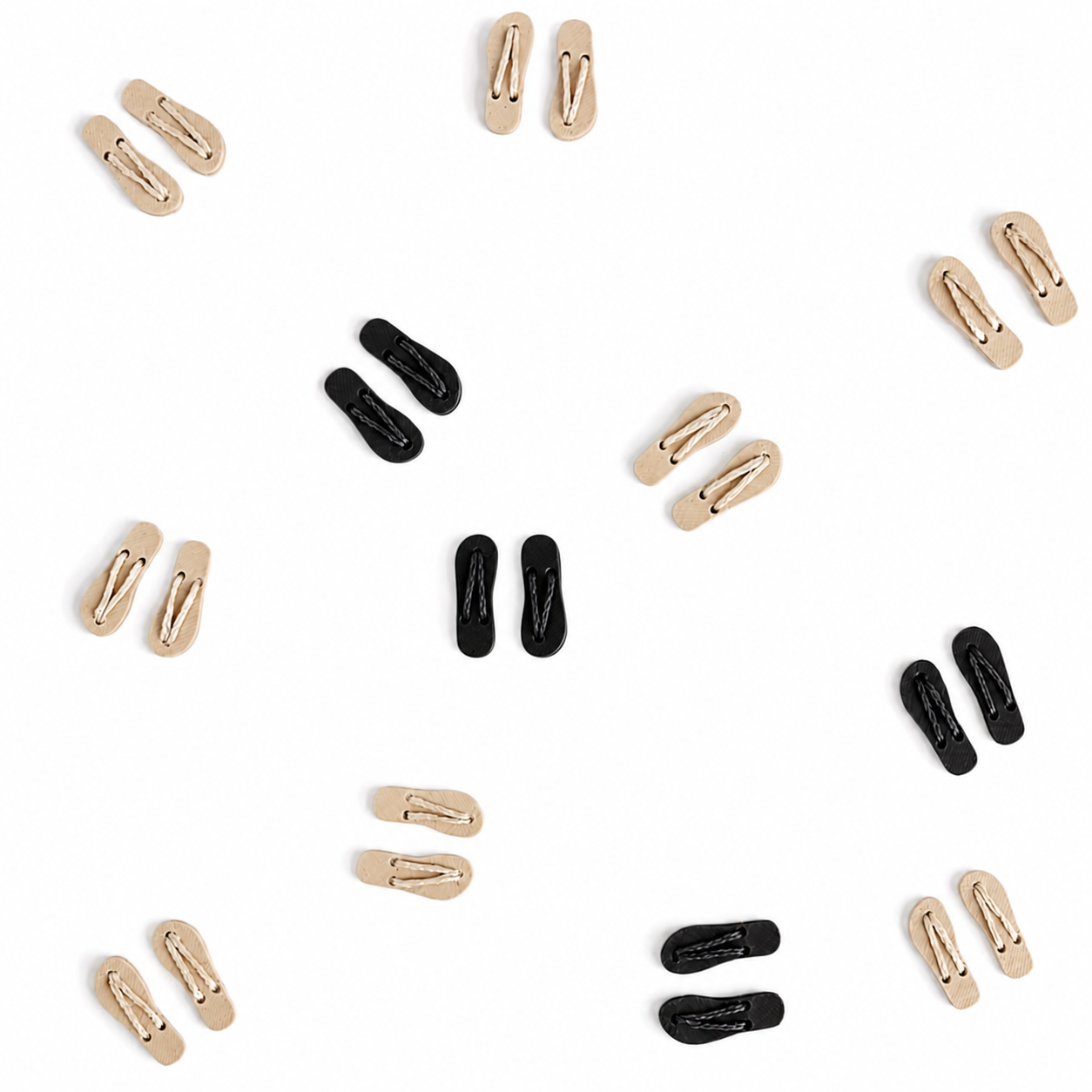 Multiple pairs of 1:12 scale flip flops arranged in a clean layout