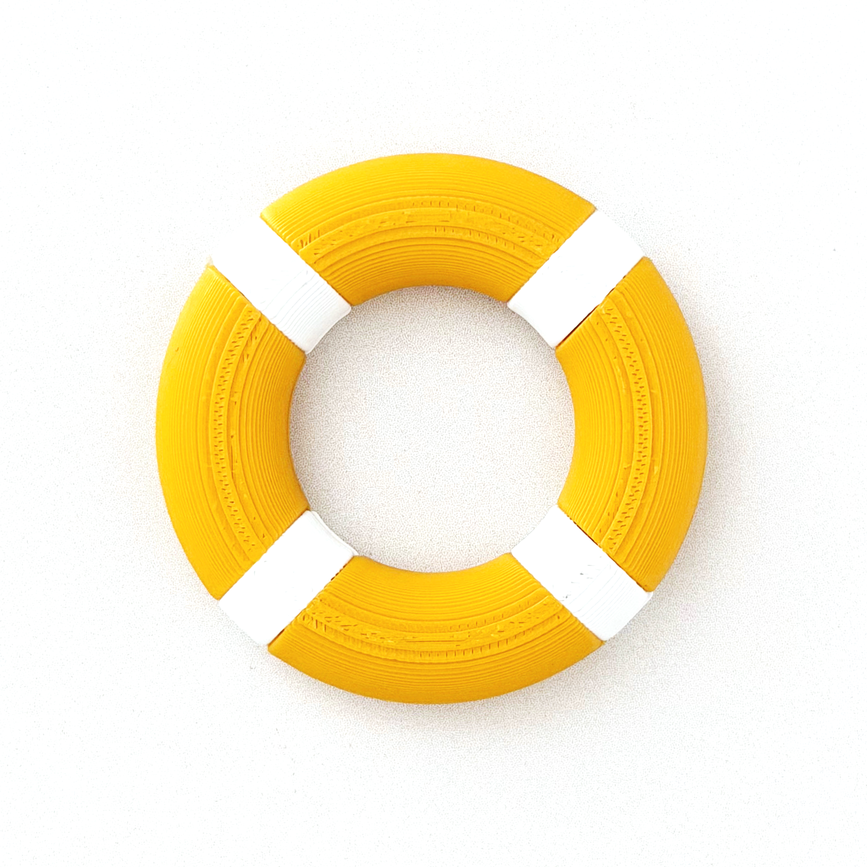 Miniature 1:12 scale life preserver on a white background.
