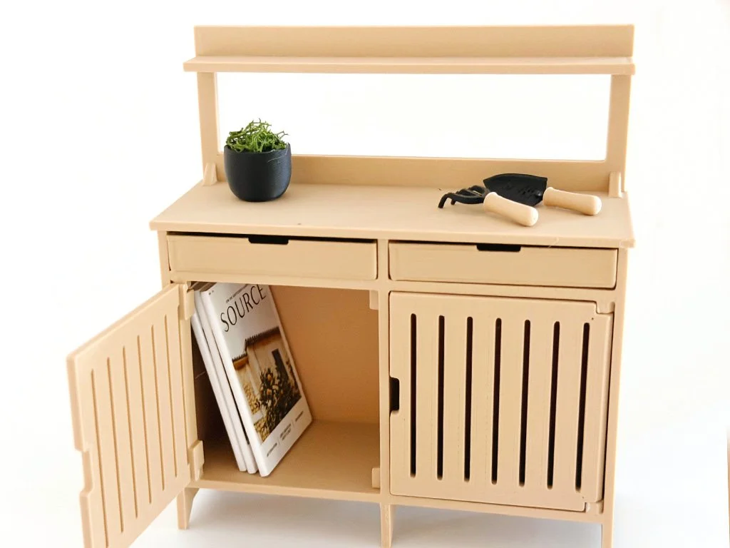 Miniature garden magazines used as styling props in a dollhouse garden or potting shed.