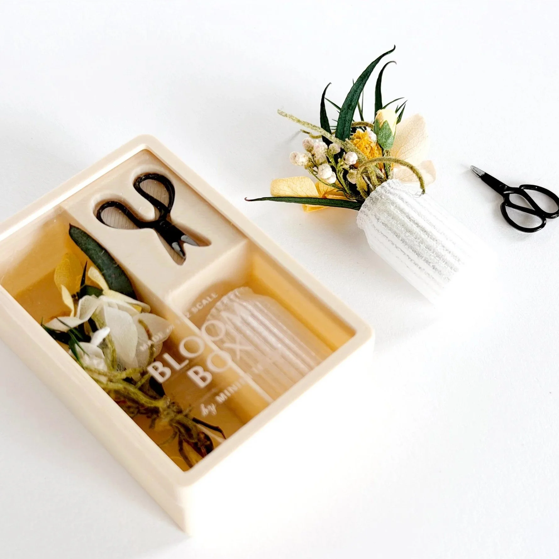Spring Yellow Bloom Box styled as miniature décor with a yellow floral arrangement in a slightly