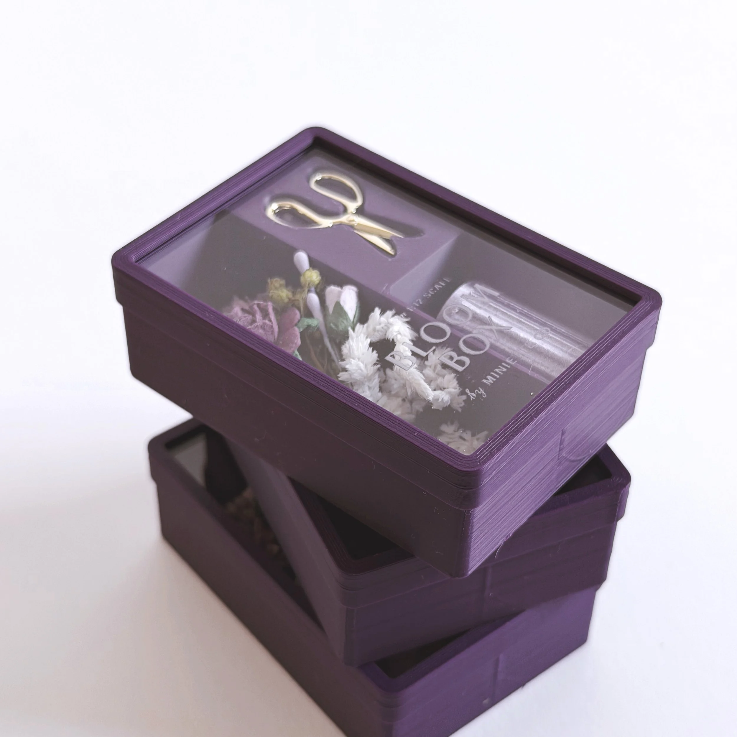 Side view of purple Bloom Box miniature floral gift set in clear display packaging