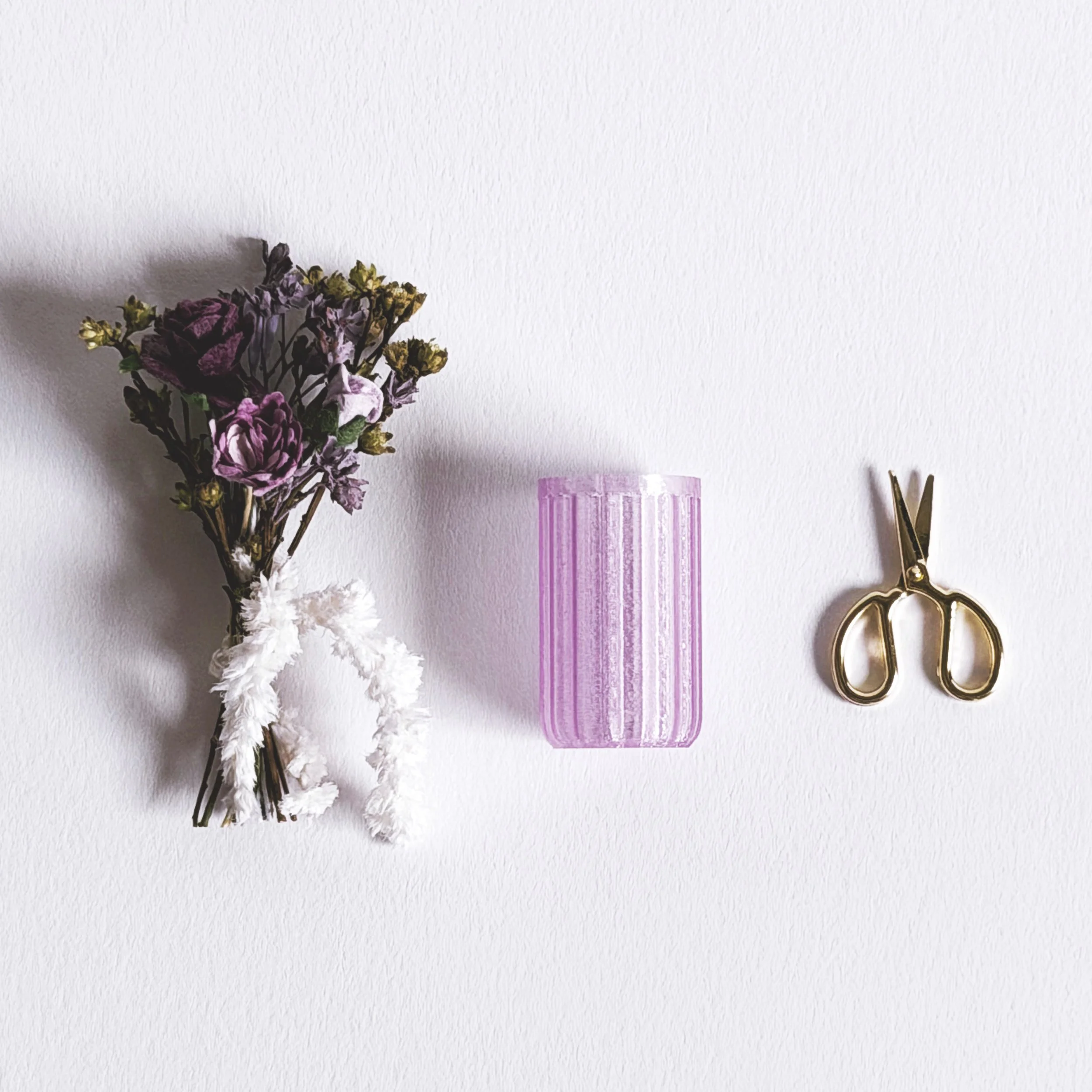 Miniature purple floral arrangement removed from box with vase and tiny scissors, dollhouse scale decor