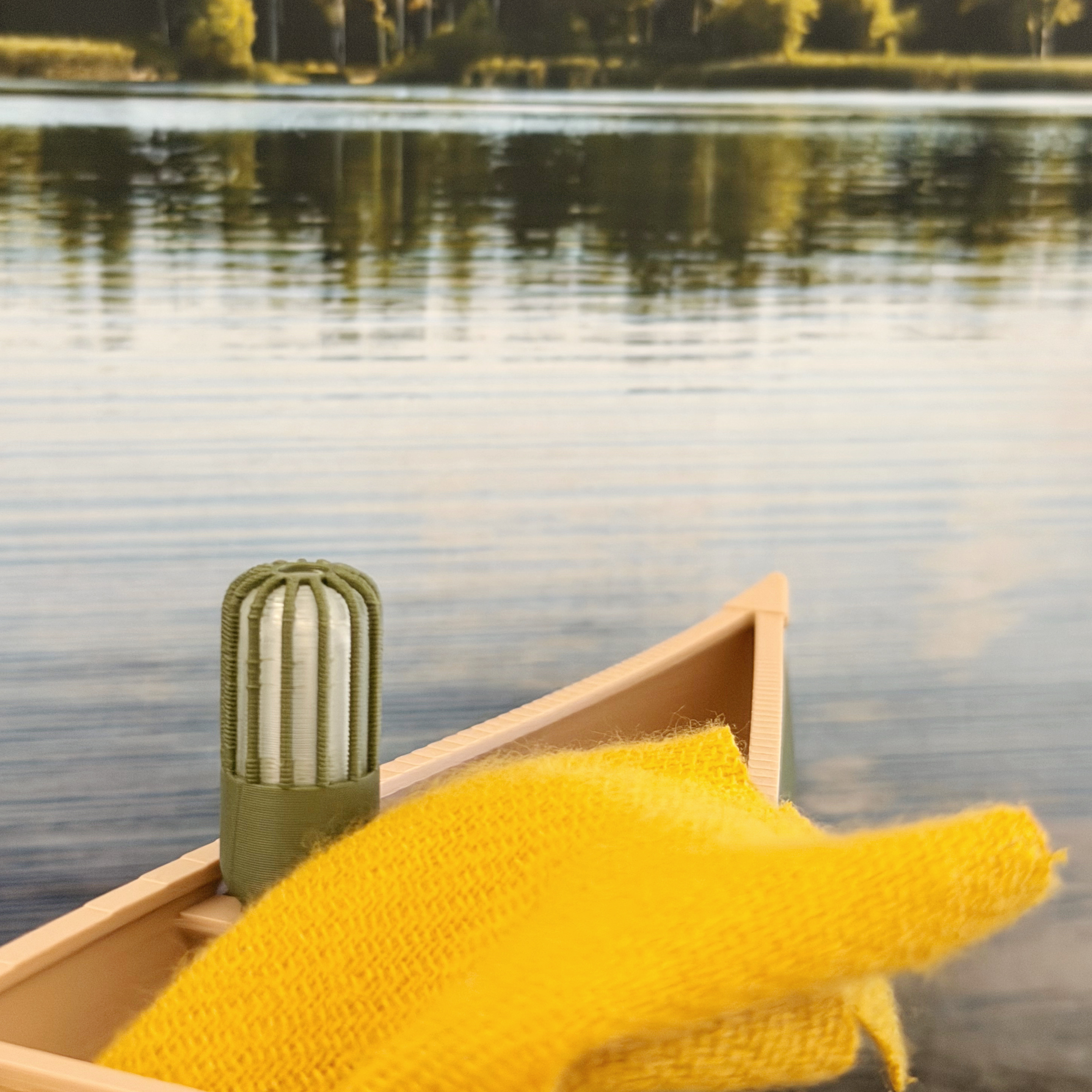 Miniature lantern accessory styled with a dollhouse canoe and campsite.