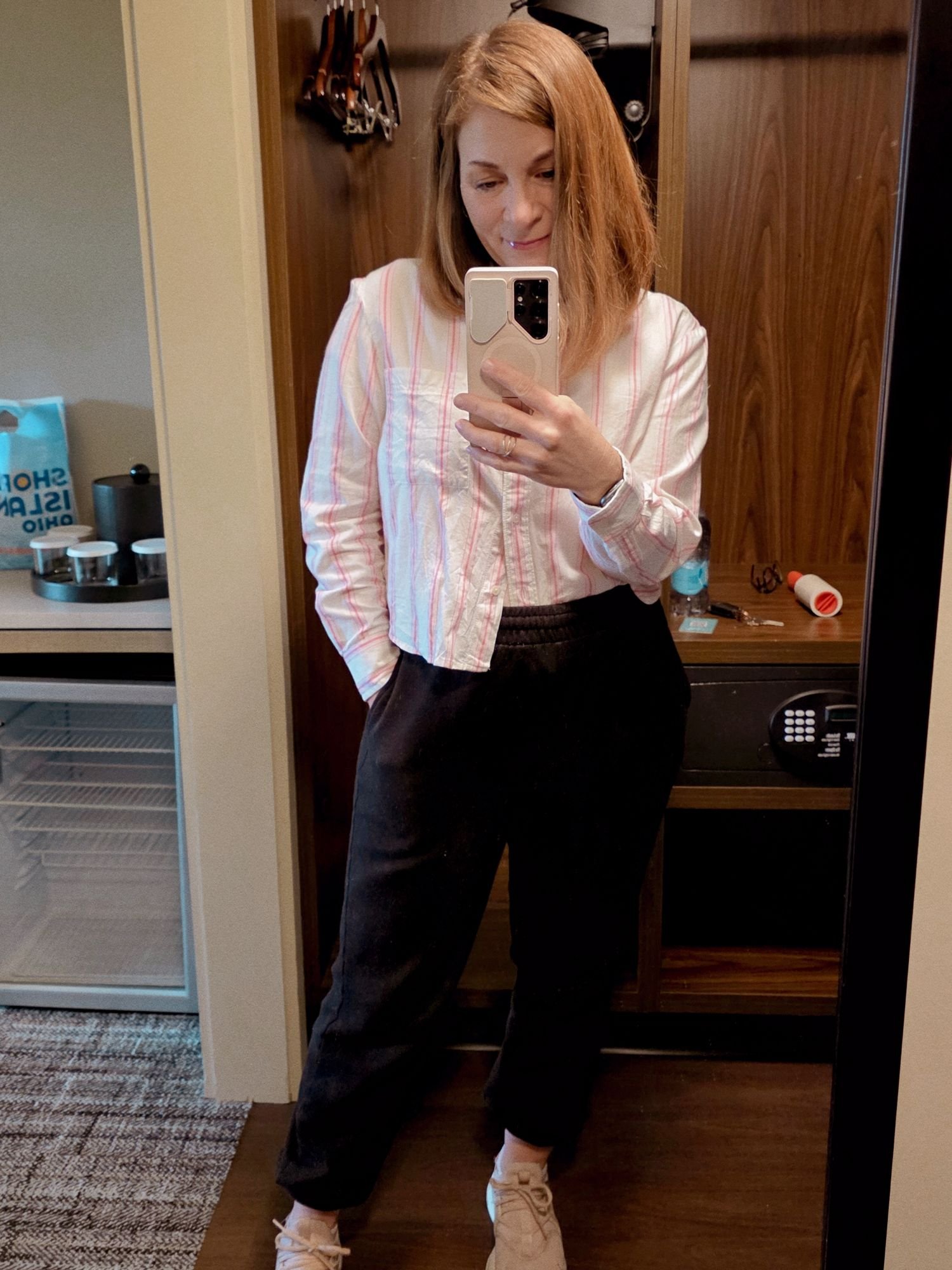 Pink pinstripe cropped button-down styled with casual sweatpants