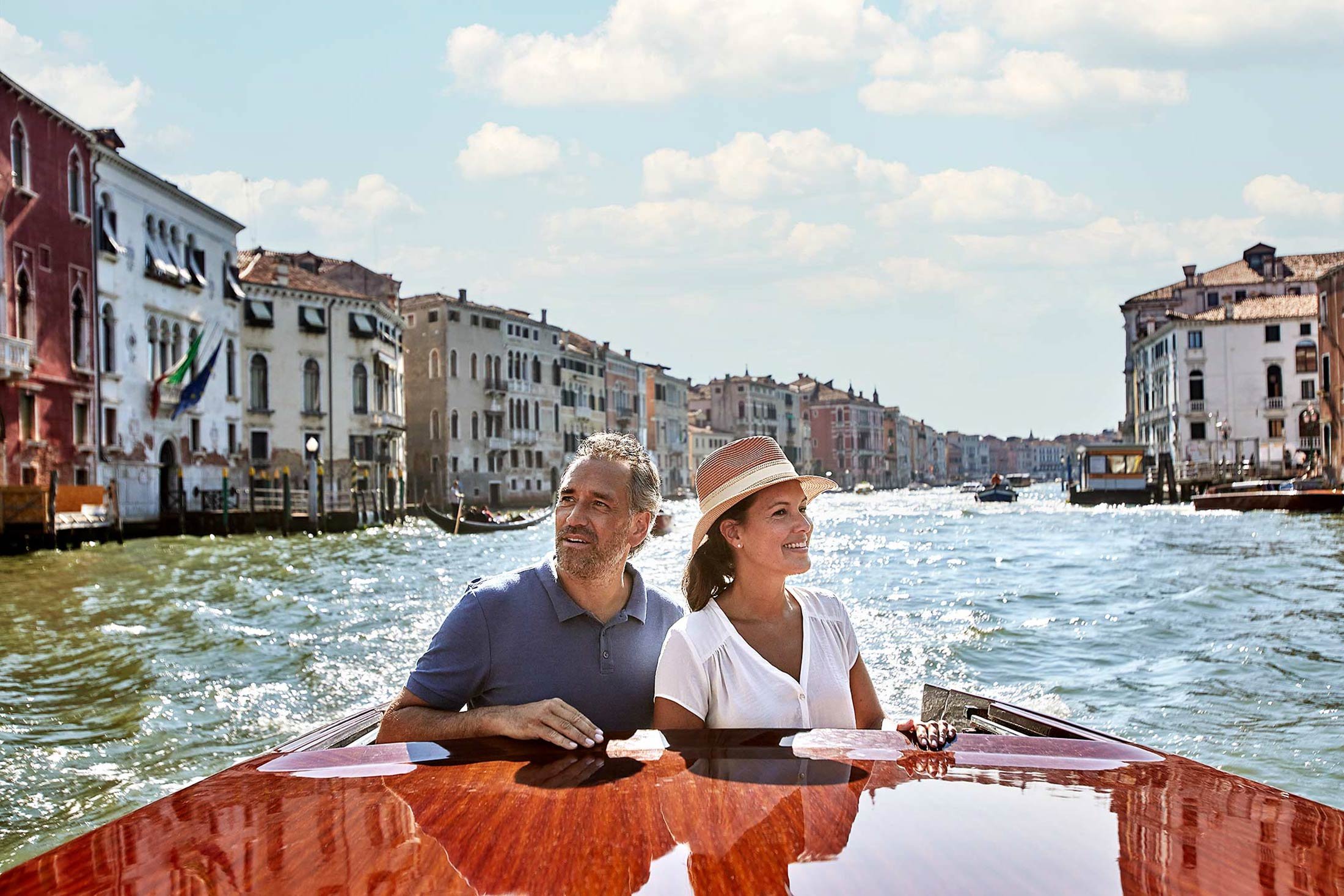 Uniworld river cruise Venice travel photography couple rowing canal luxury hospitality
