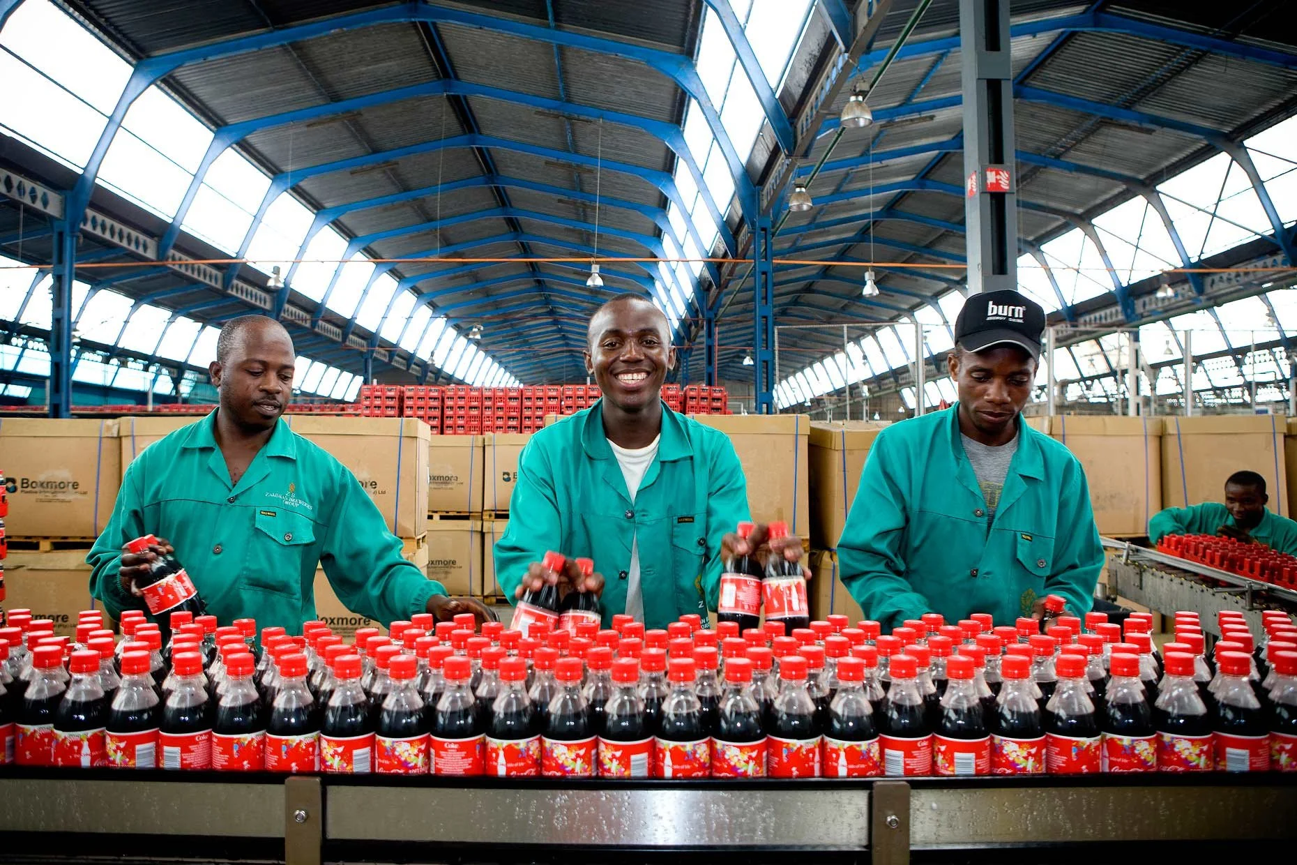Inside the Coca-Cola factory in Zambia, showcasing industrial production processes and local beverage manufacturing.